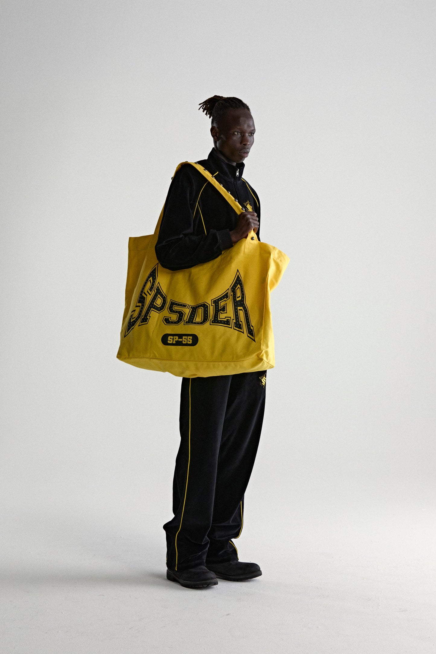 YELLOW T&F STUDDED TOTE ON MODEL