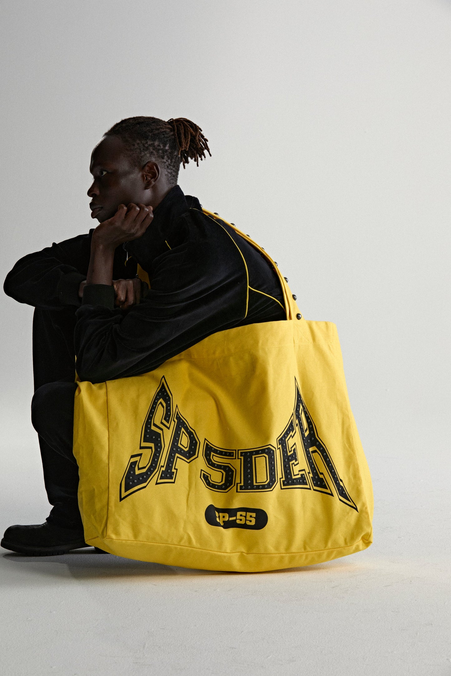 YELLOW T&F STUDDED TOTE ON MODEL