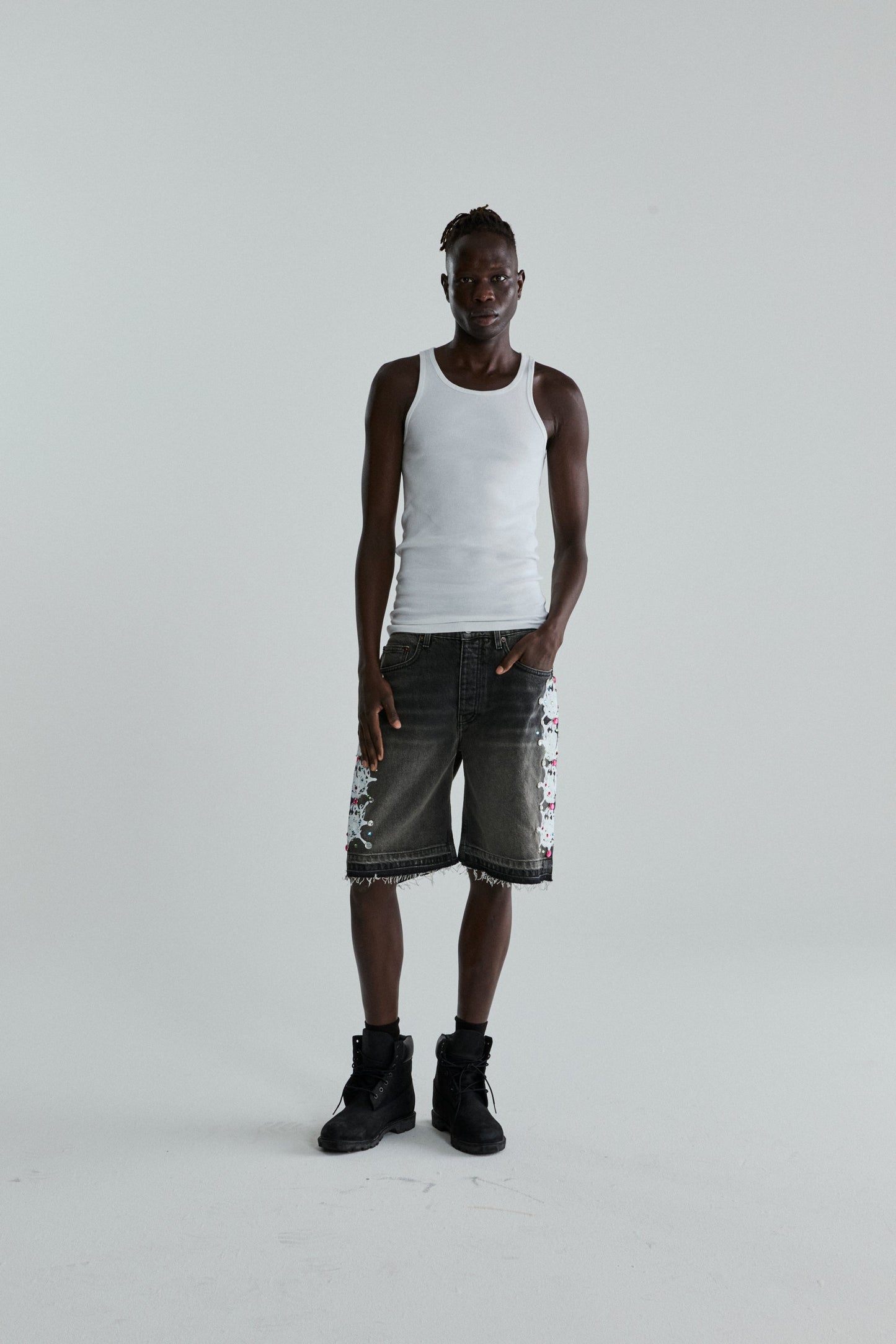 BLACK WASH WEB STONE DENIM SHORTS ON MODEL
