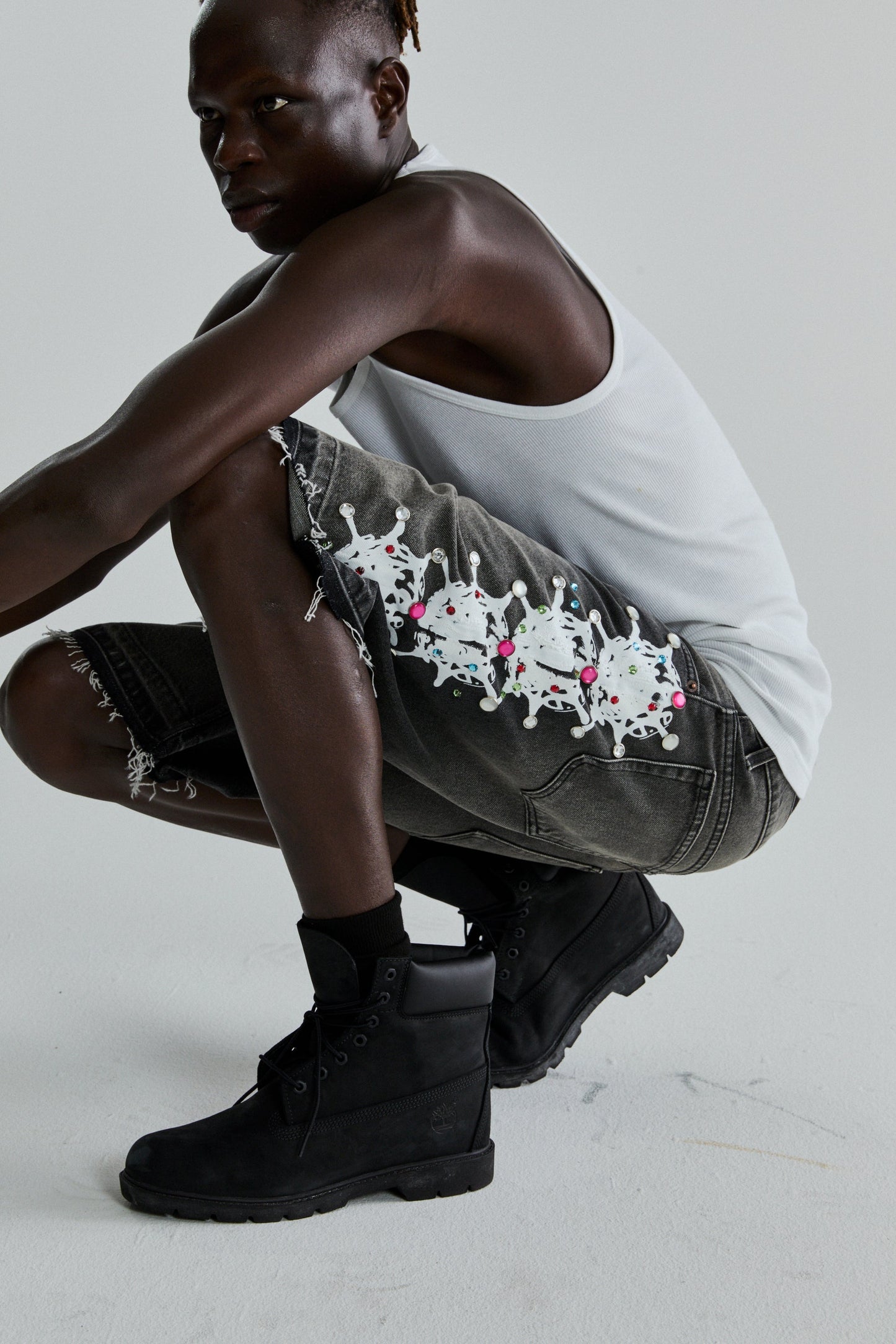 BLACK WASH WEB STONE DENIM SHORTS ON MODEL