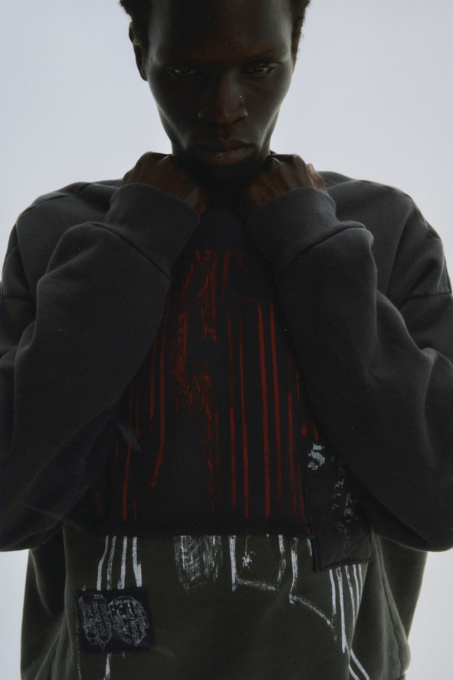 BLACK DIFFUSED COLLEGIATE CREWNECK ON MODEL