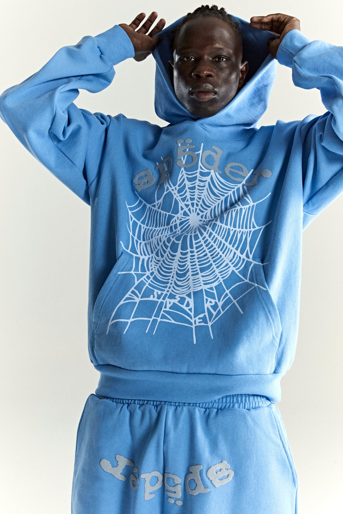 DUSTY BLUE OG WEB V2 HOODIE ON MODEL