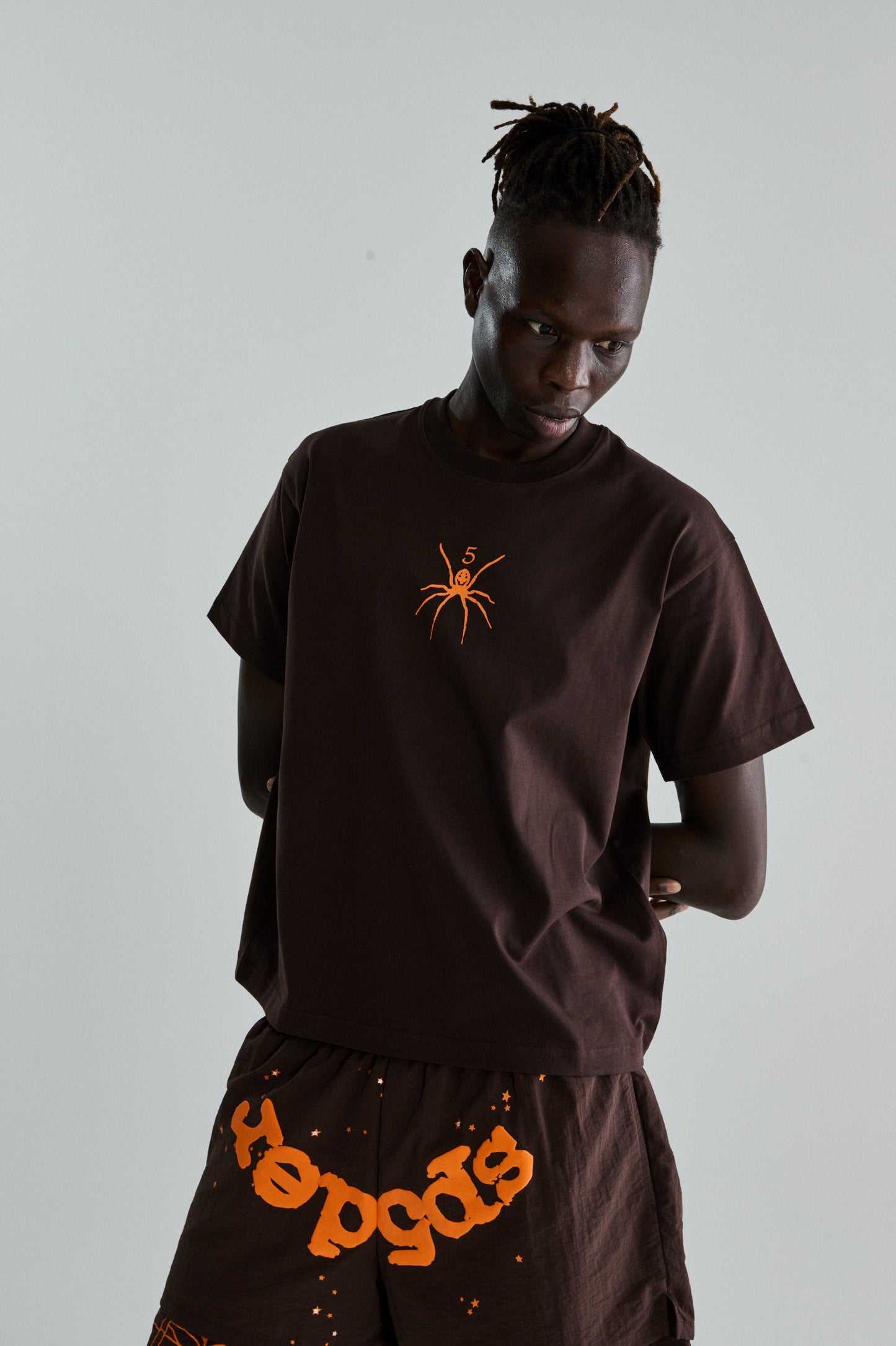 BROWN TM TEE ON MODEL