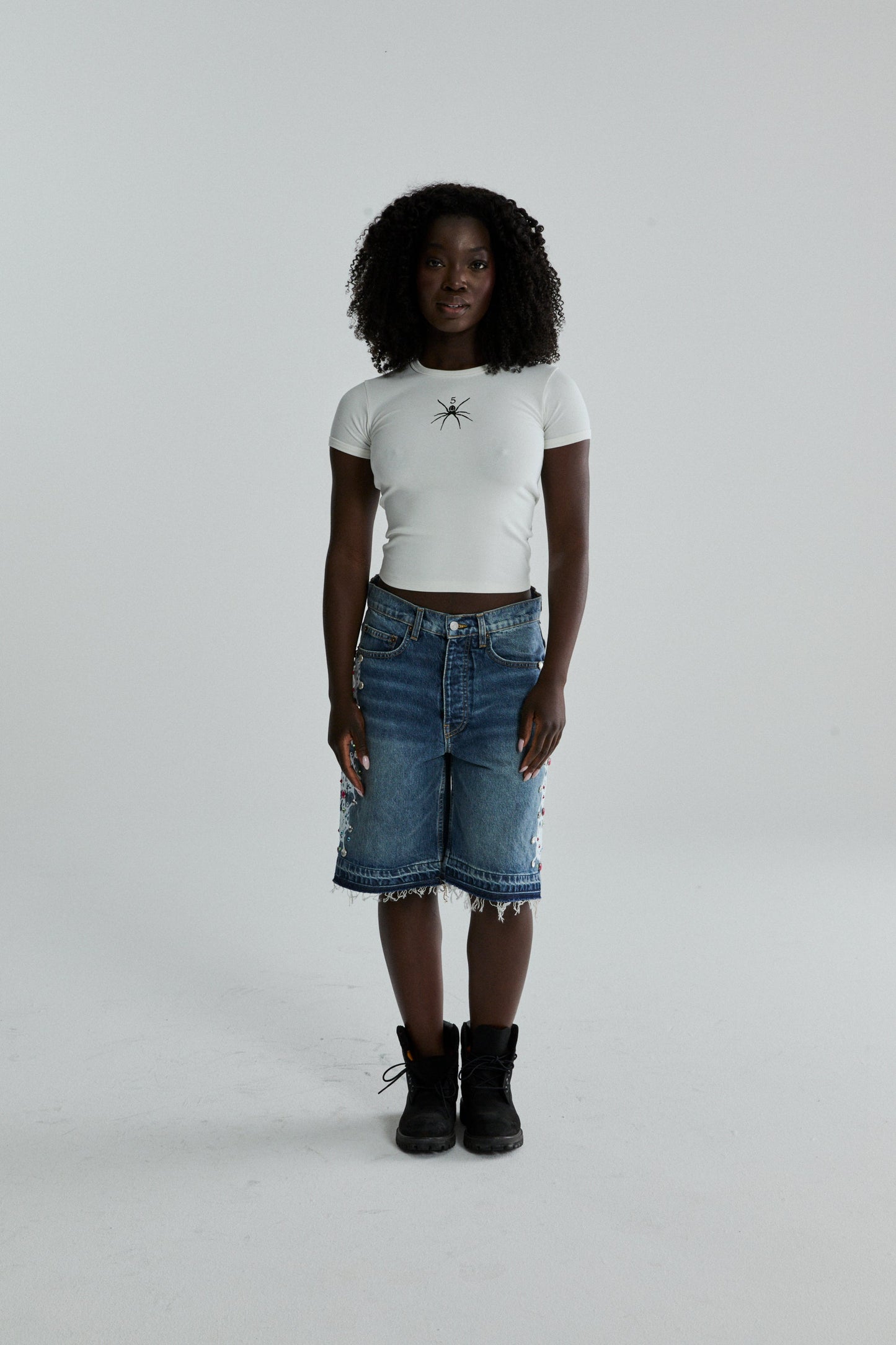 WHITE TM BABY TEE ON MODEL
