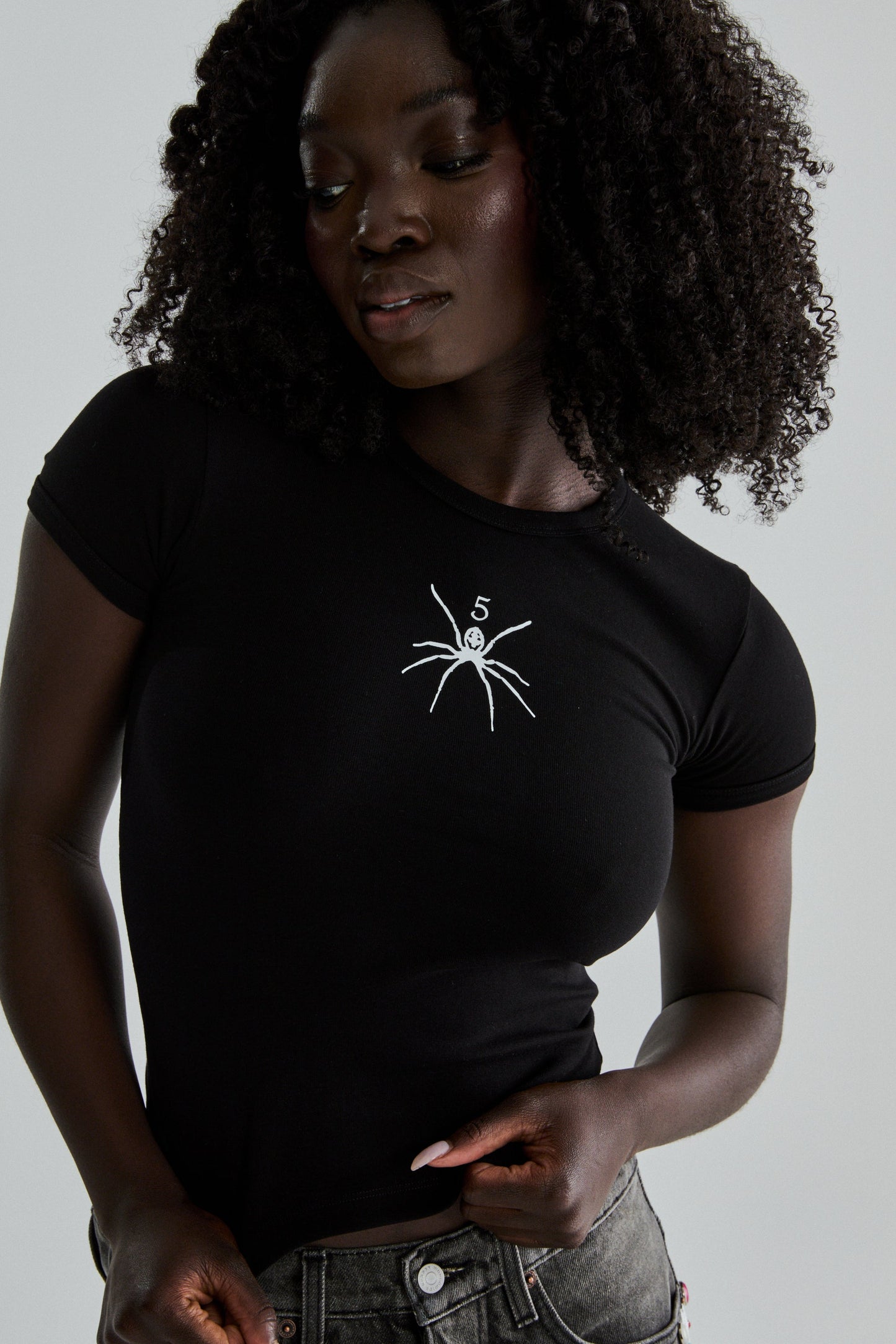 BLACK TM BABY TEE ON MODEL