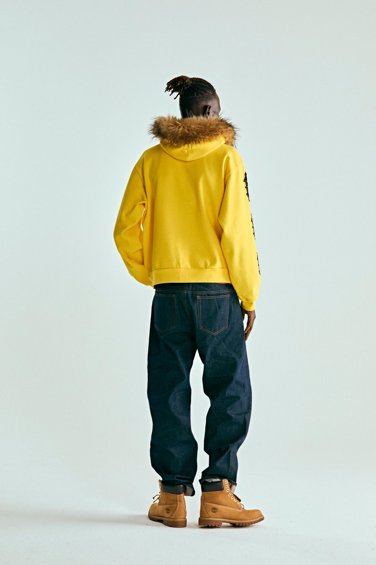 YELLOW FUR HOODED ZIP UP SWEATSHIRT ON MODEL