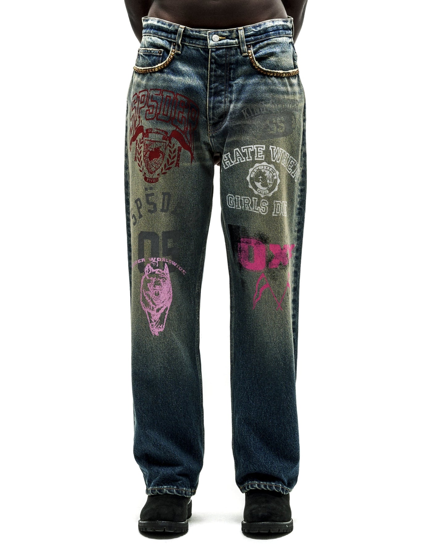 Distressed blue jeans with bold red, pink, and white graphic prints, chain details on the waist.