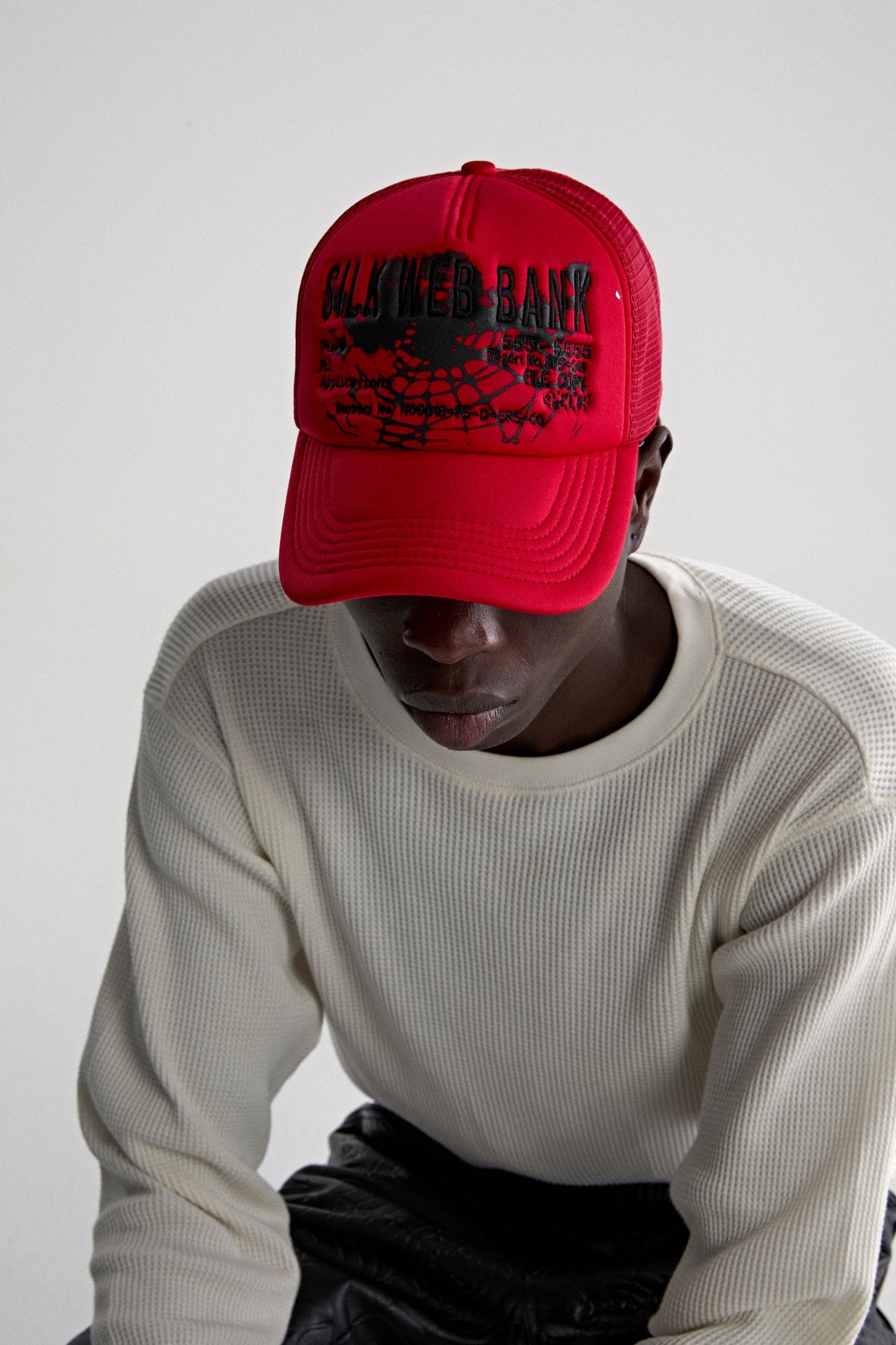 RED SILK WEB BANK TRUCKER ON MODEL