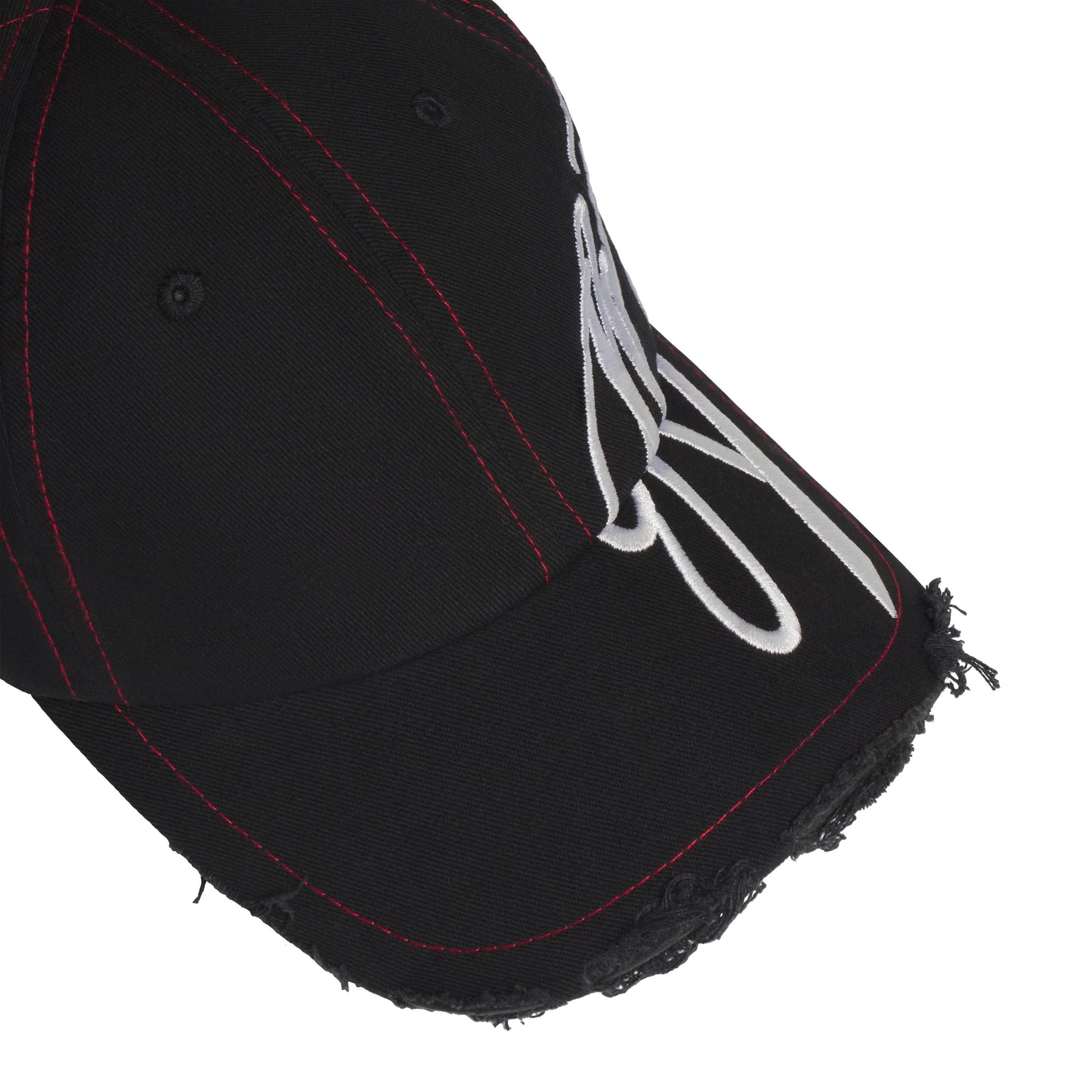 Black baseball hat with red stitching, distressed brim edges, and white cursive graphic embroidery extending to the side.