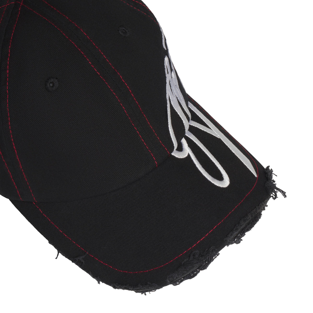 Black baseball hat with red stitching, distressed brim edges, and white cursive graphic embroidery extending to the side.