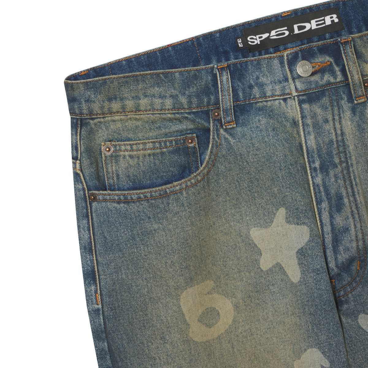 Blue denim jeans with a faded Beluga graphic print, custom branded hardware, and a SP5DER logo patch at the waist.