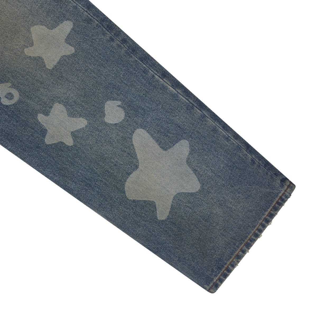 Blue denim jeans featuring a faded white star graphic print and a classic straight leg fit.