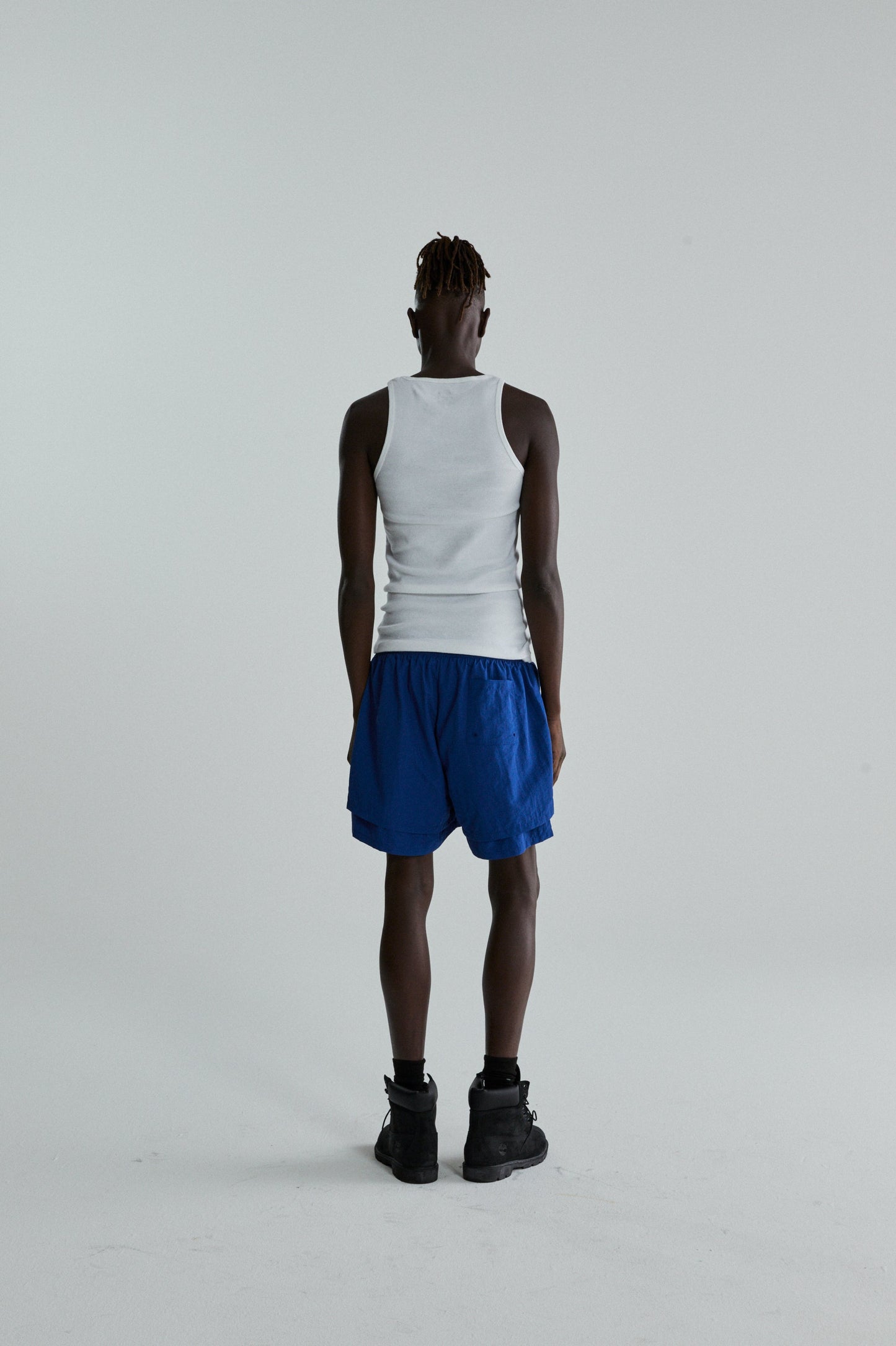 BLUE OG WEB DOUBLE LAYER SHORTS ON MODEL