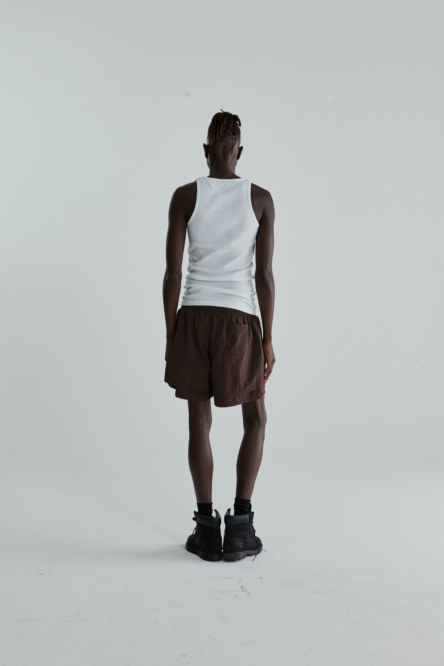 BROWN OG WEB DOUBLE LAYER SHORTS ON MODEL