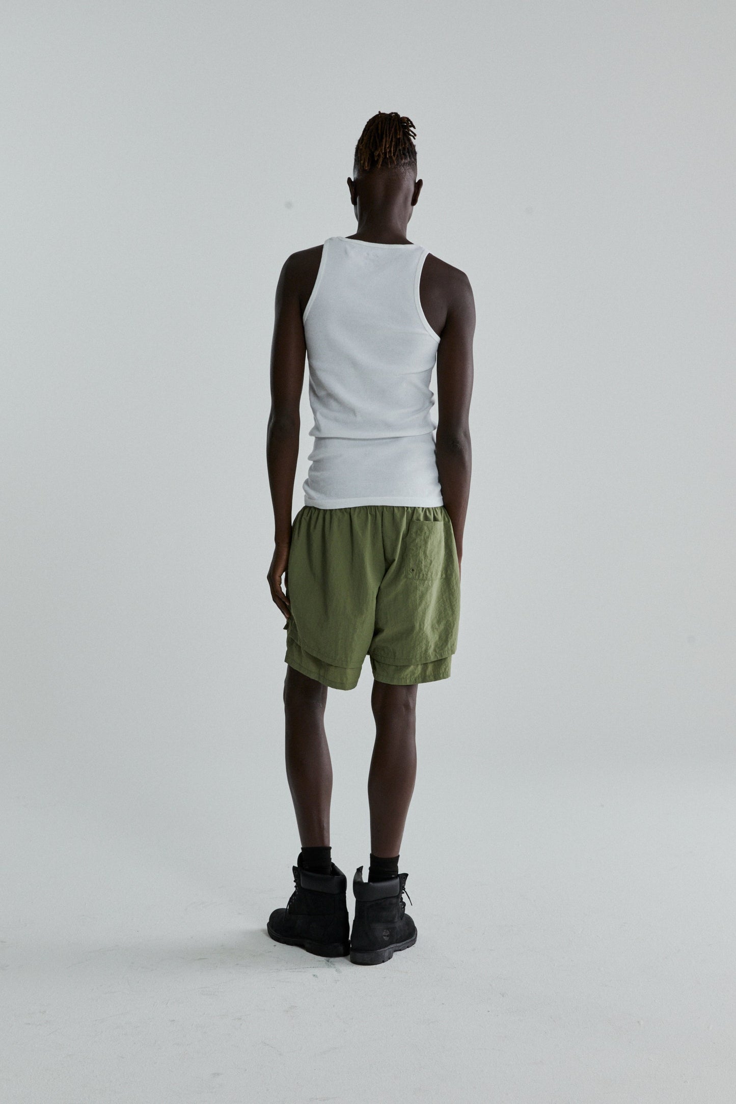 SAGE GREEN OG WEB DOUBLE LAYER SHORTS ON MODEL