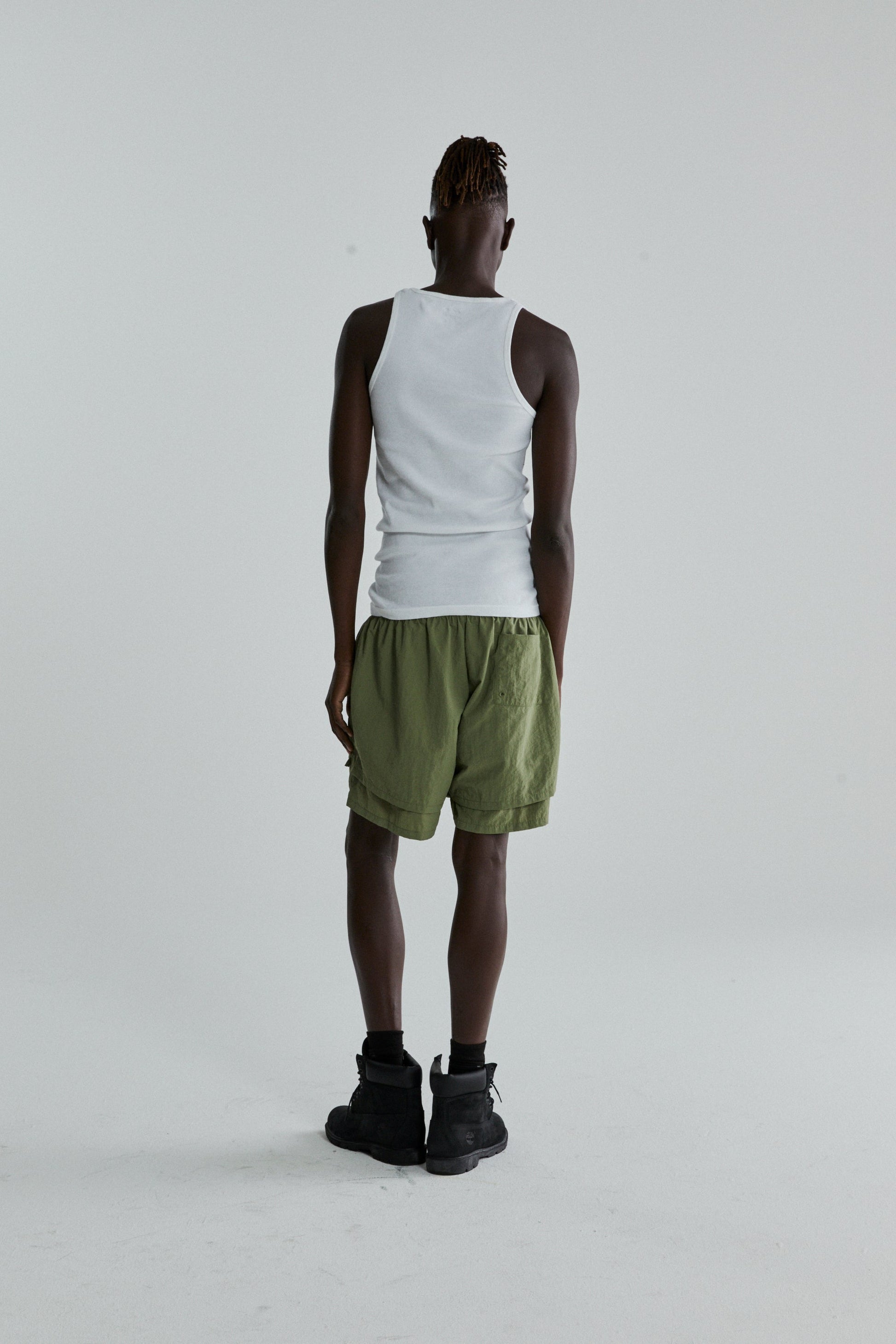 SAGE GREEN OG WEB DOUBLE LAYER SHORTS ON MODEL