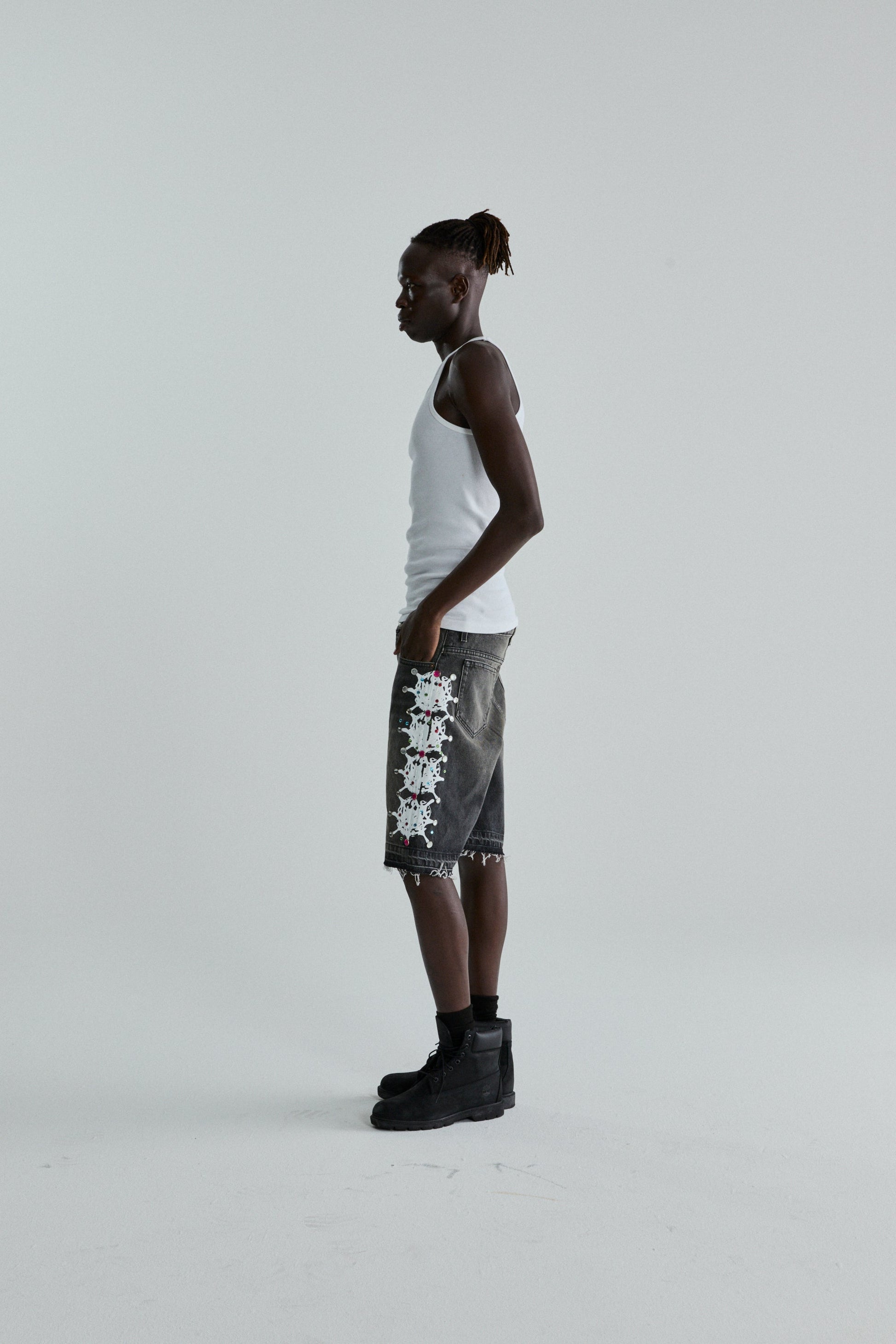 BLACK WASH WEB STONE DENIM SHORTS ON MODEL
