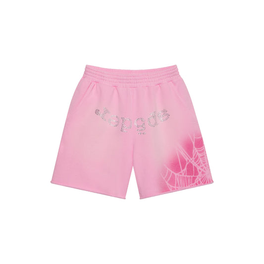 Pink cotton fleece sweatshorts with rhinestone "SP5DER" text and a white spray web graphic design.