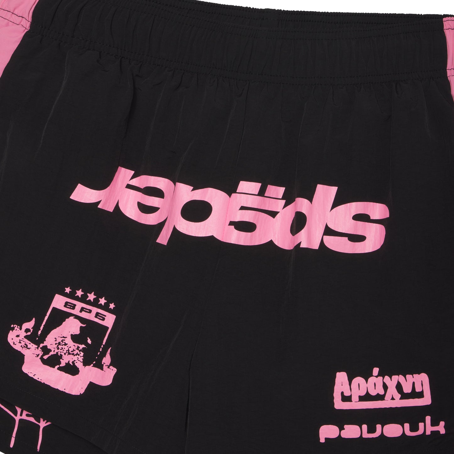 Black 4oz water repellent nylon double layer shorts with pink graphic print, wide side stripe, and elastic waistband.