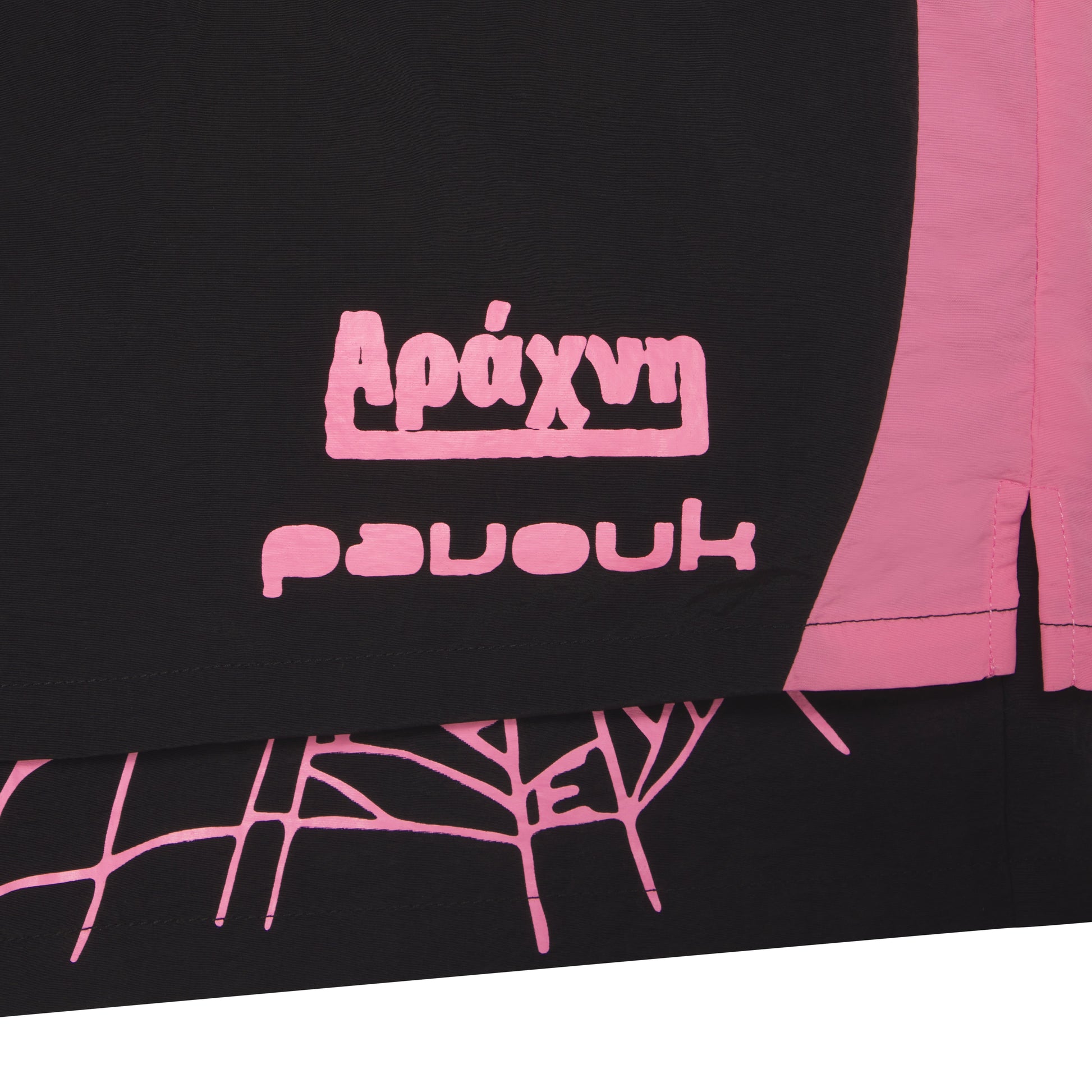 Black water repellent nylon double layer short with pink graphic print and wide side stripe.