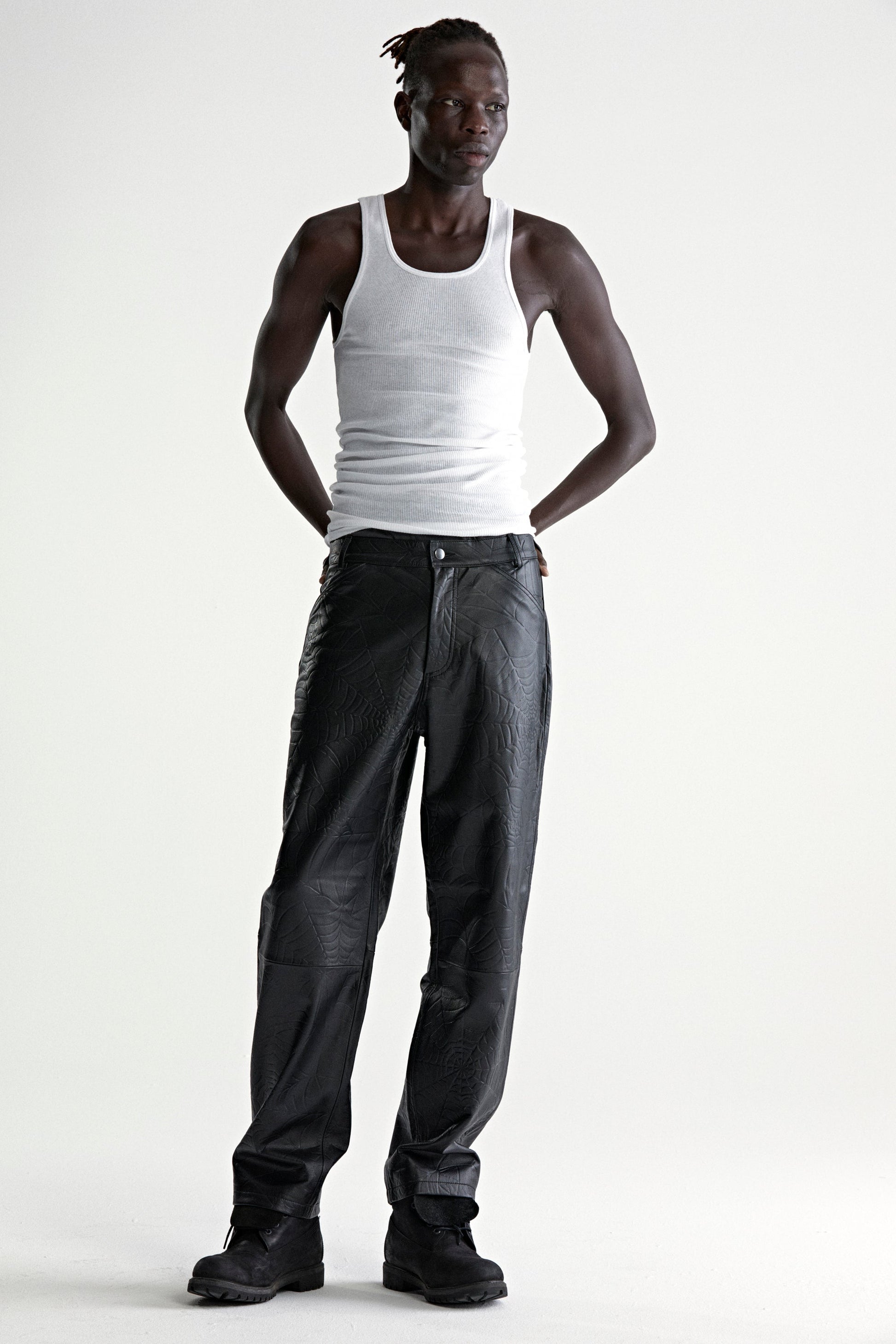 BLACK DEBOSSED WEB LEATHER PANT ON MODEL