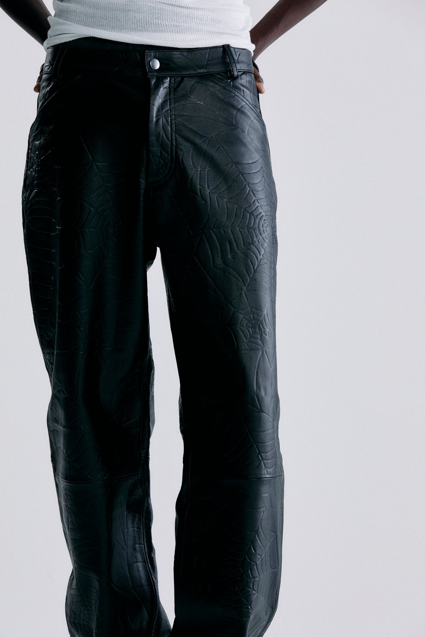 BLACK DEBOSSED WEB LEATHER PANT ON MODEL