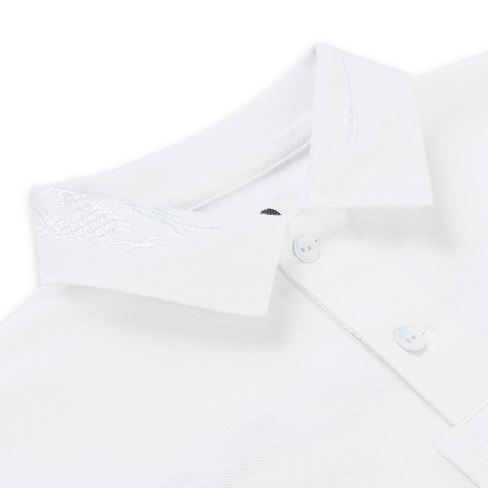 White pique polo shirt with an embroidered collar and three light buttons.