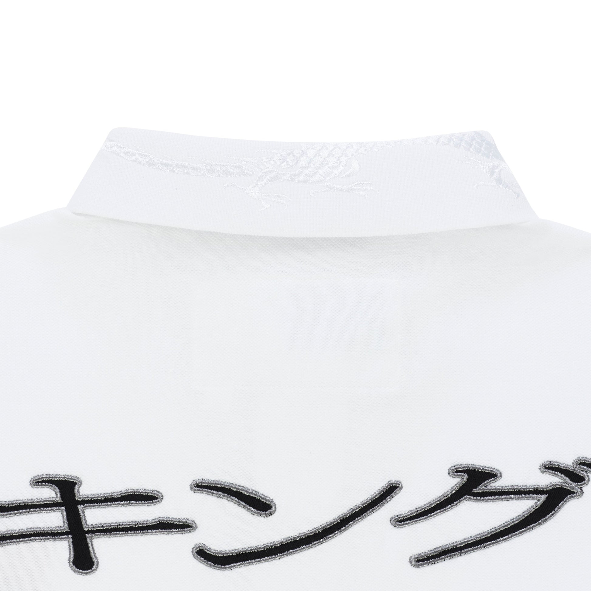 White polo shirt with embroidered dragon on collar and black Japanese characters.
