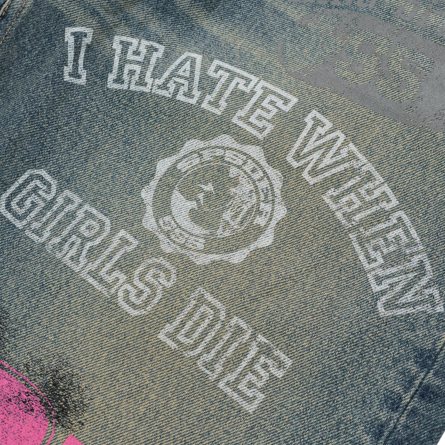 Distressed blue denim jeans with "I HATE WHEN GIRLS DIE" white print and circular logo.