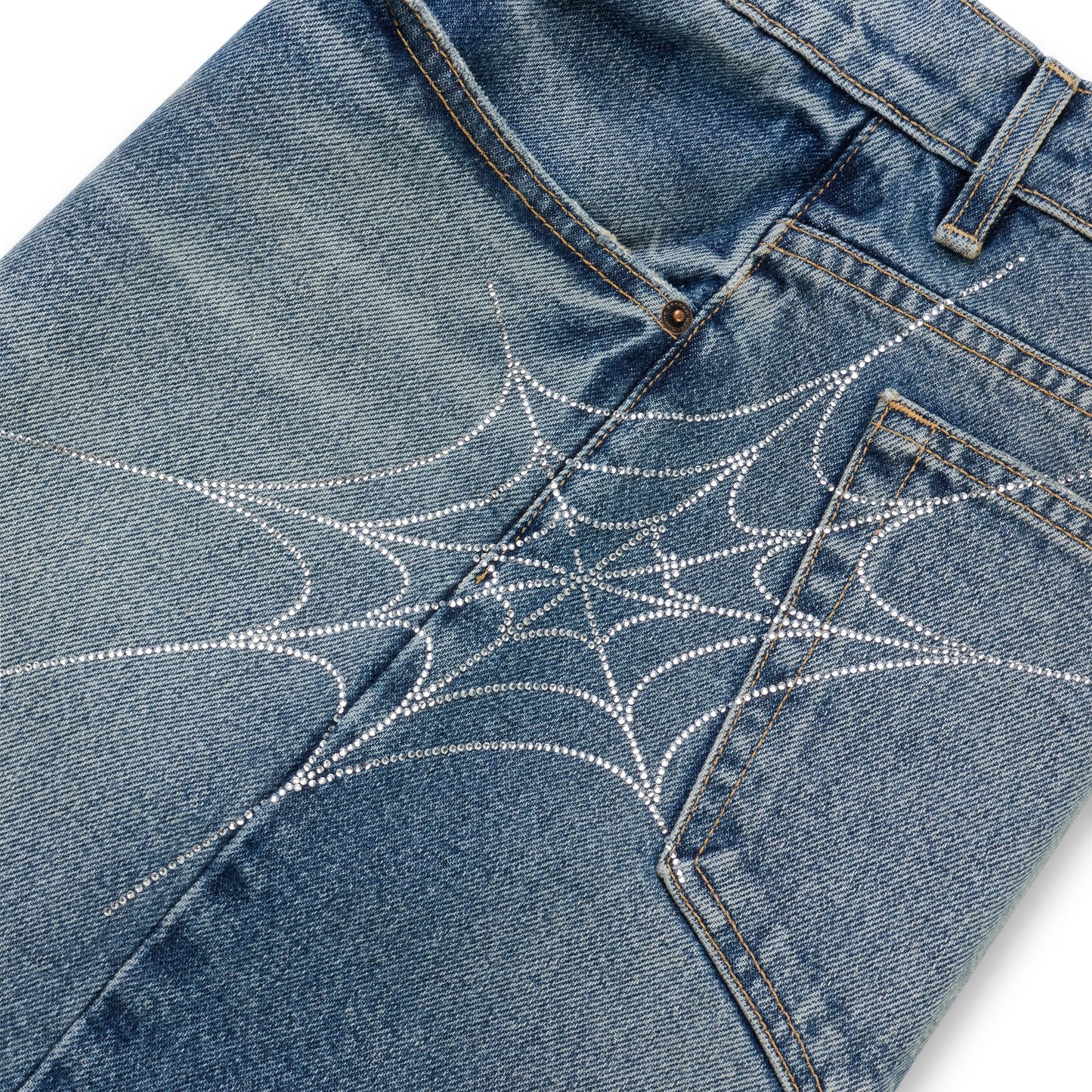 Washed blue denim shorts with a sparkling rhinestone spiderweb design across the back.