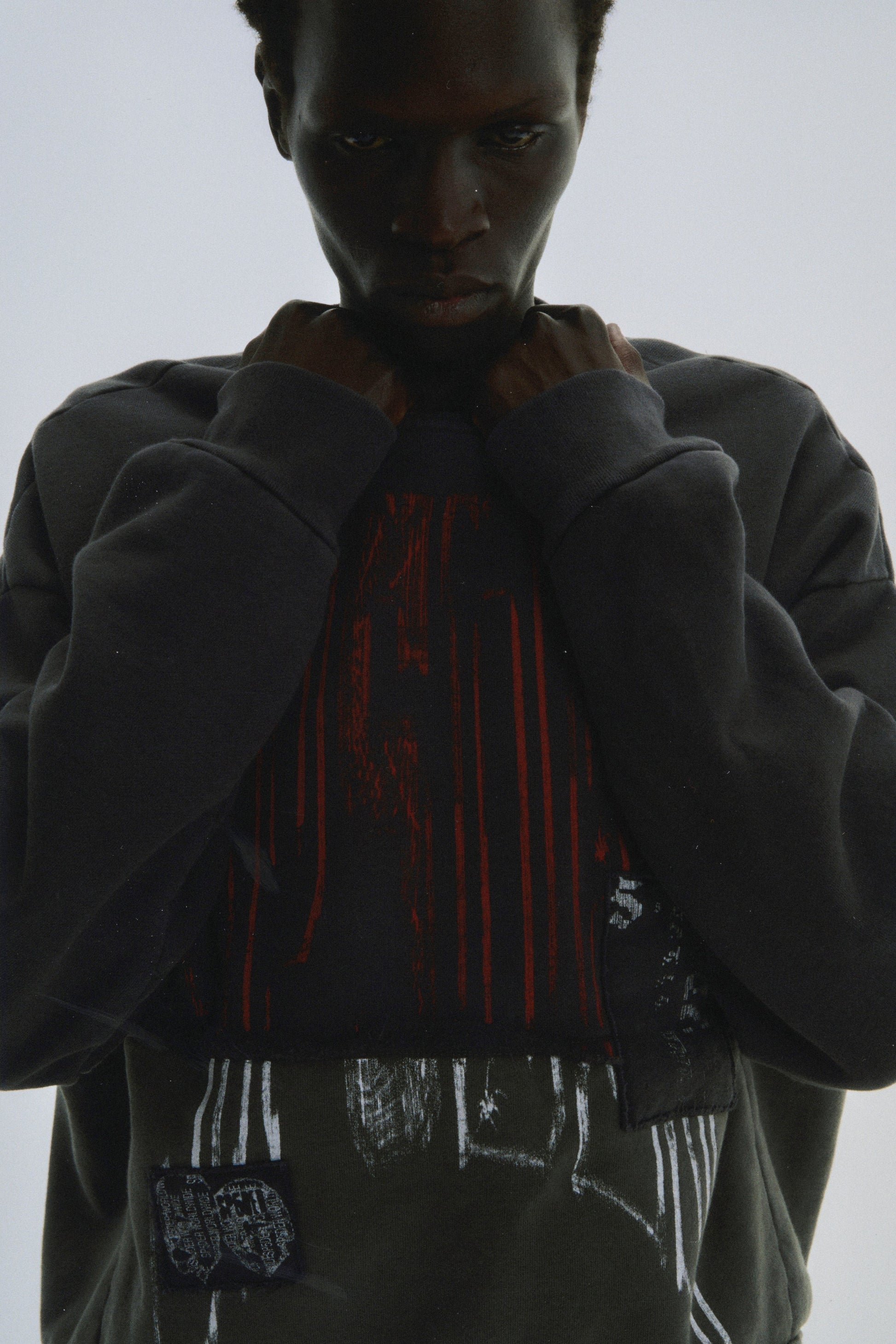 BLACK DIFFUSED COLLEGIATE CREWNECK ON MODEL