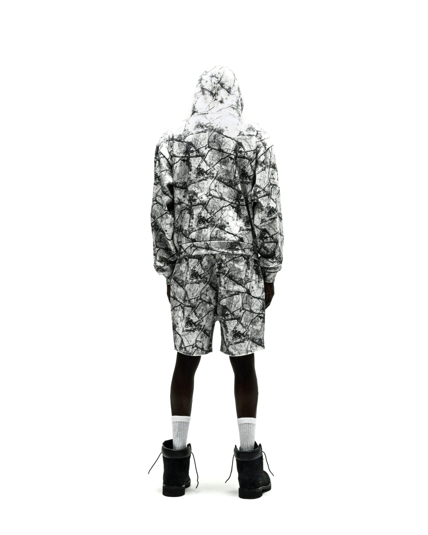 REALTREE OG WEB V2 sweatsuit with white and black camouflage print, hoodie, and shorts.