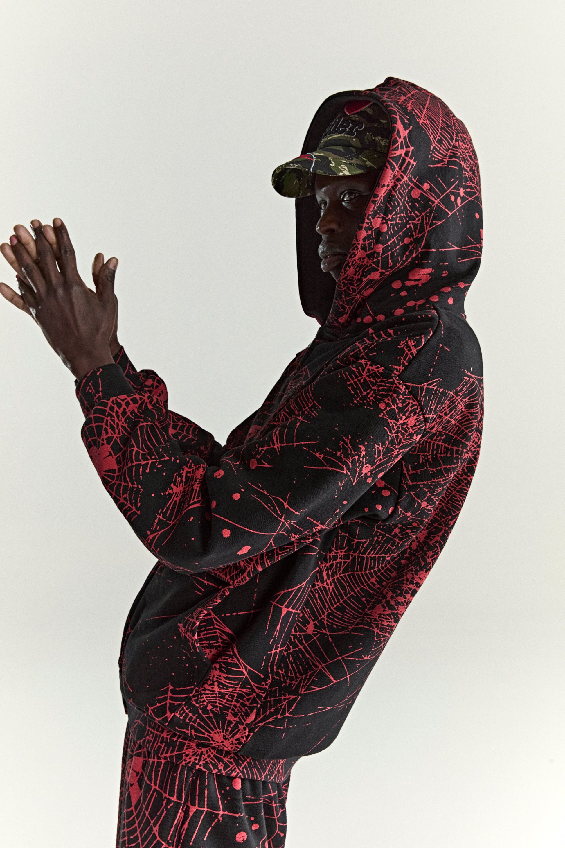 BLACK AOP WEB ZIP UP V2 HOODIE ON MODEL
