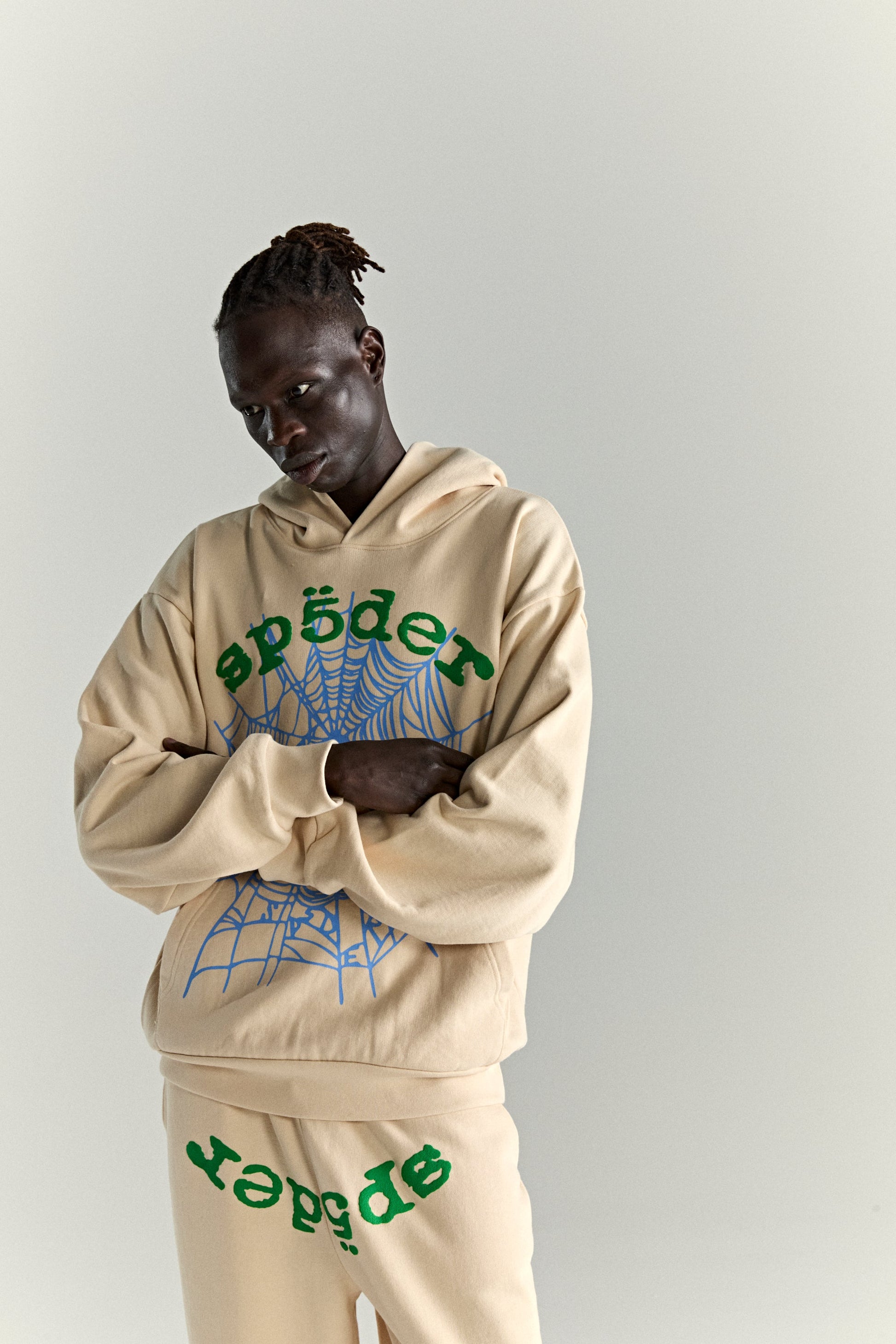 CREAM OG WEB V2 HOODIE ON MODEL