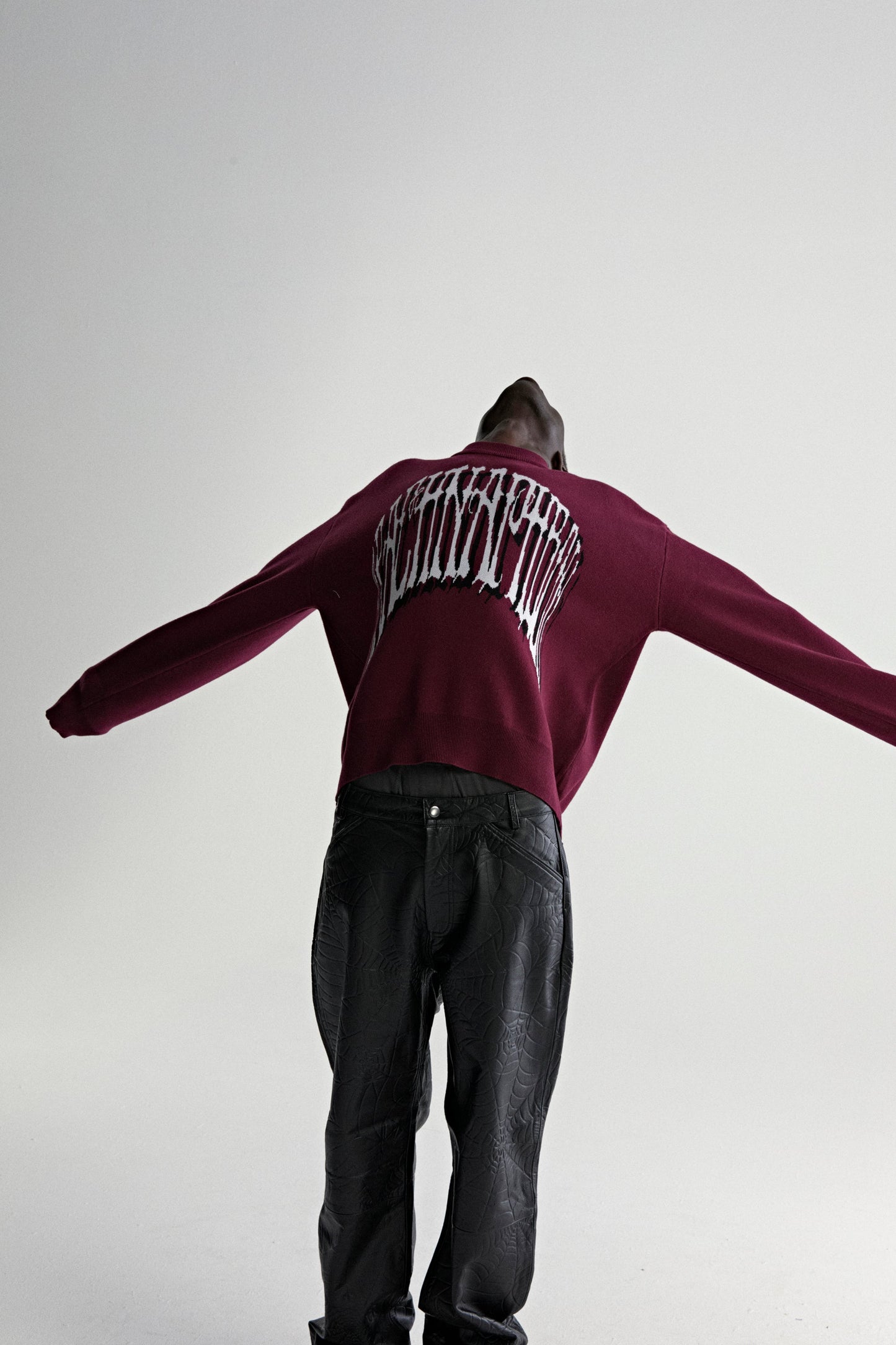 BURGUNDY ARACHNAPHOBIA SWEATER ON MODEL