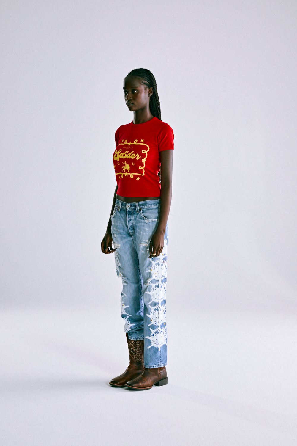 RED RODEO POSTER BABY TEE ON MODEL