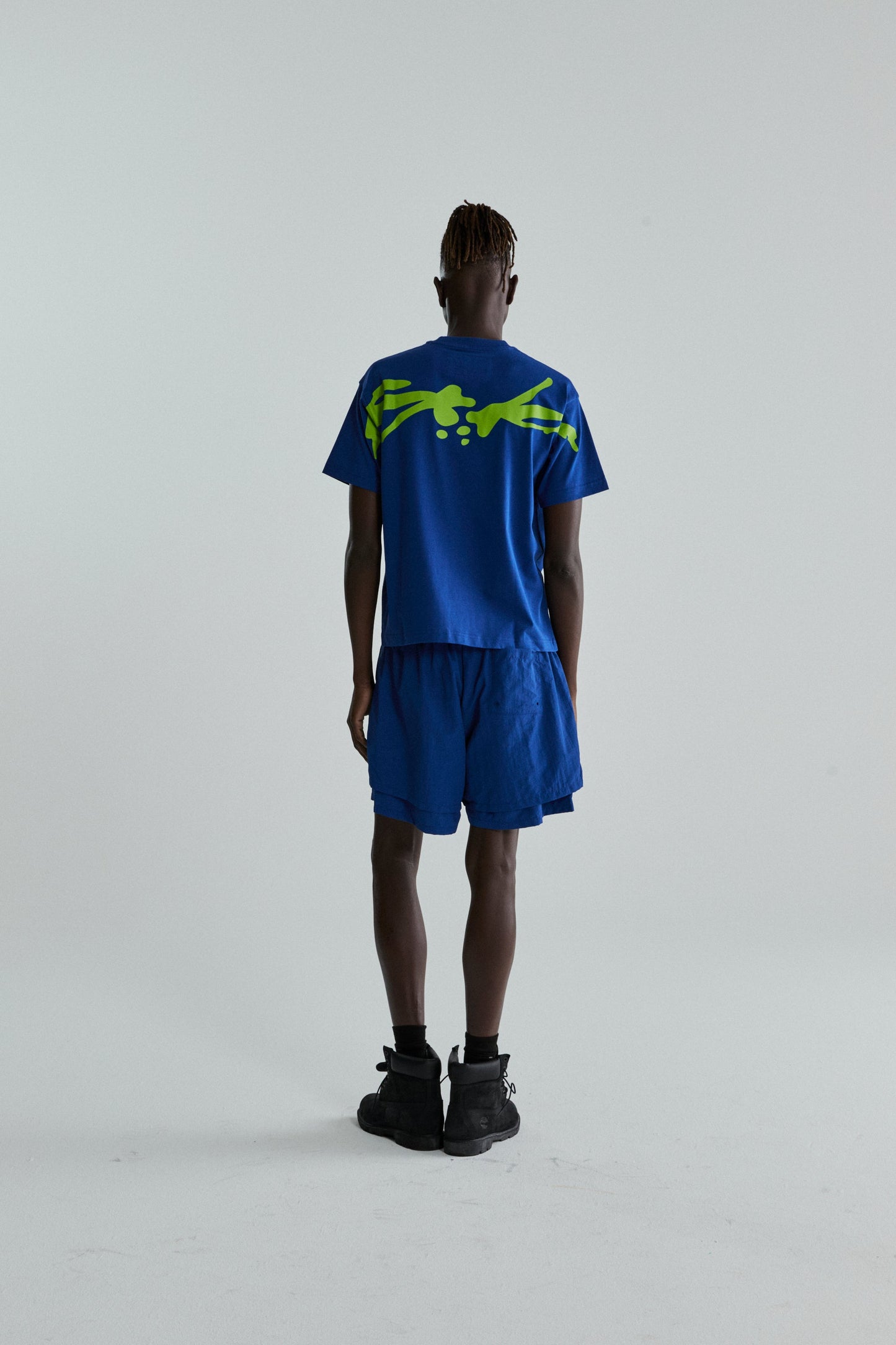BLUE TM TEE ON MODEL