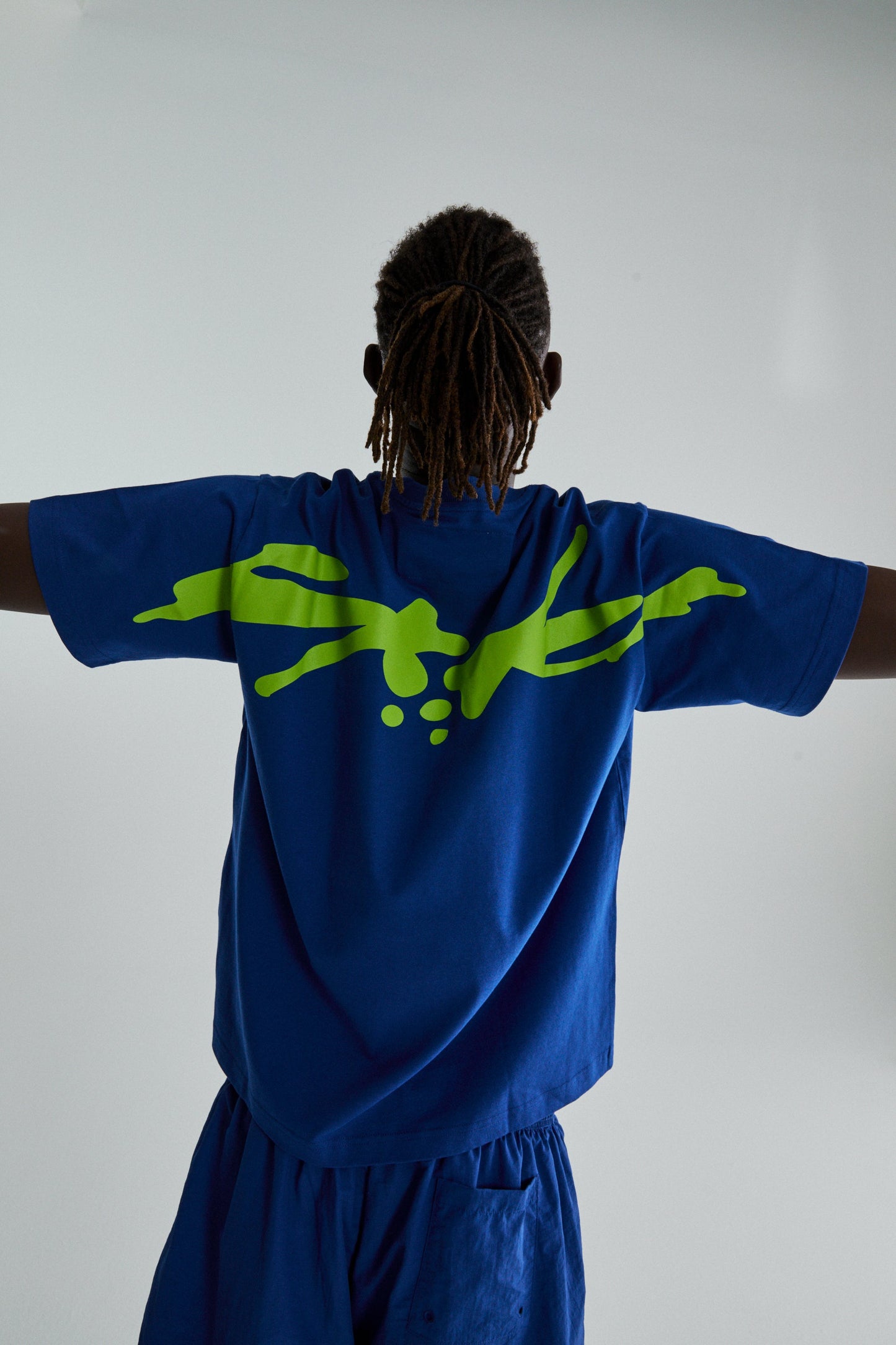BLUE TM TEE ON MODEL