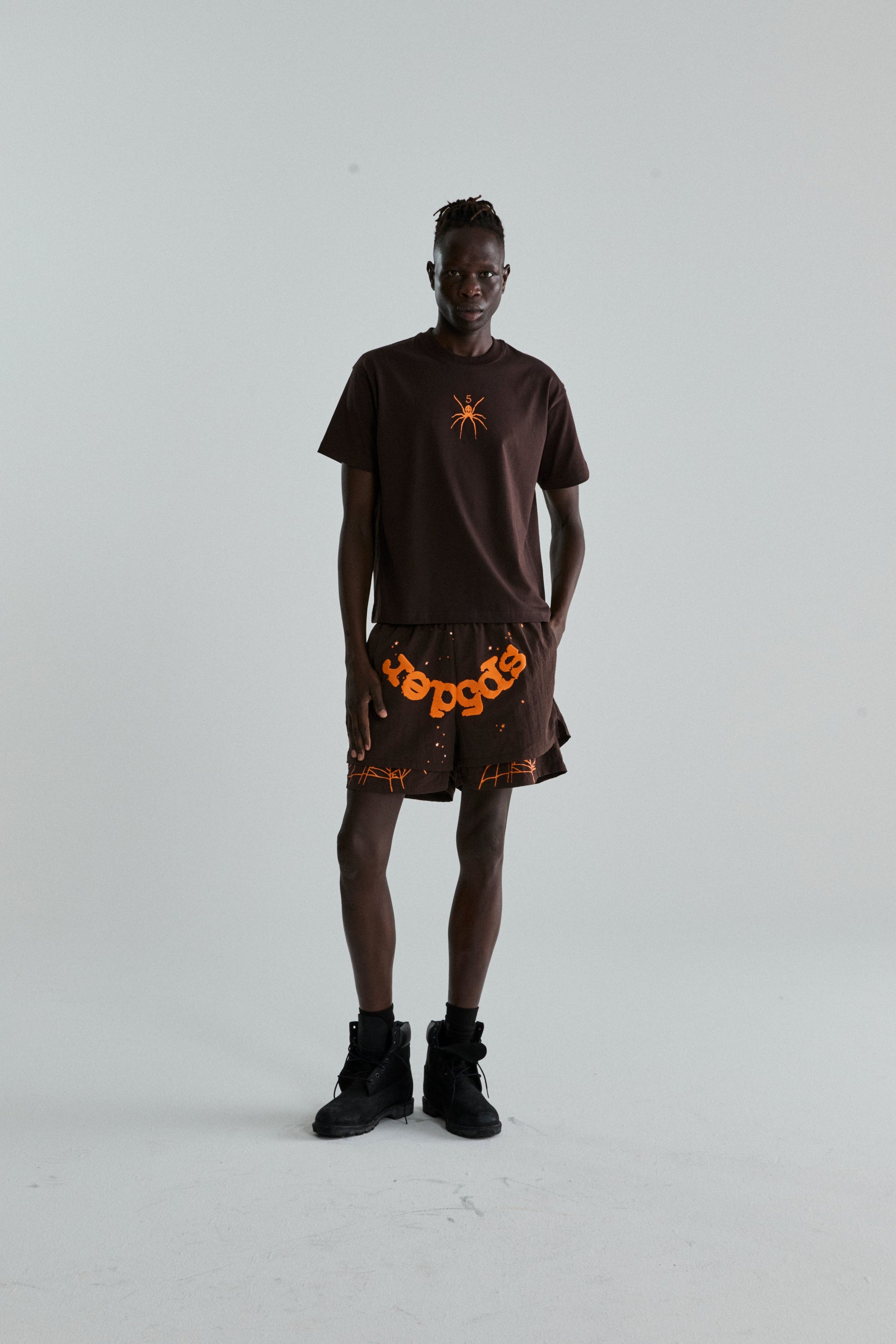 BROWN TM TEE ON MODEL