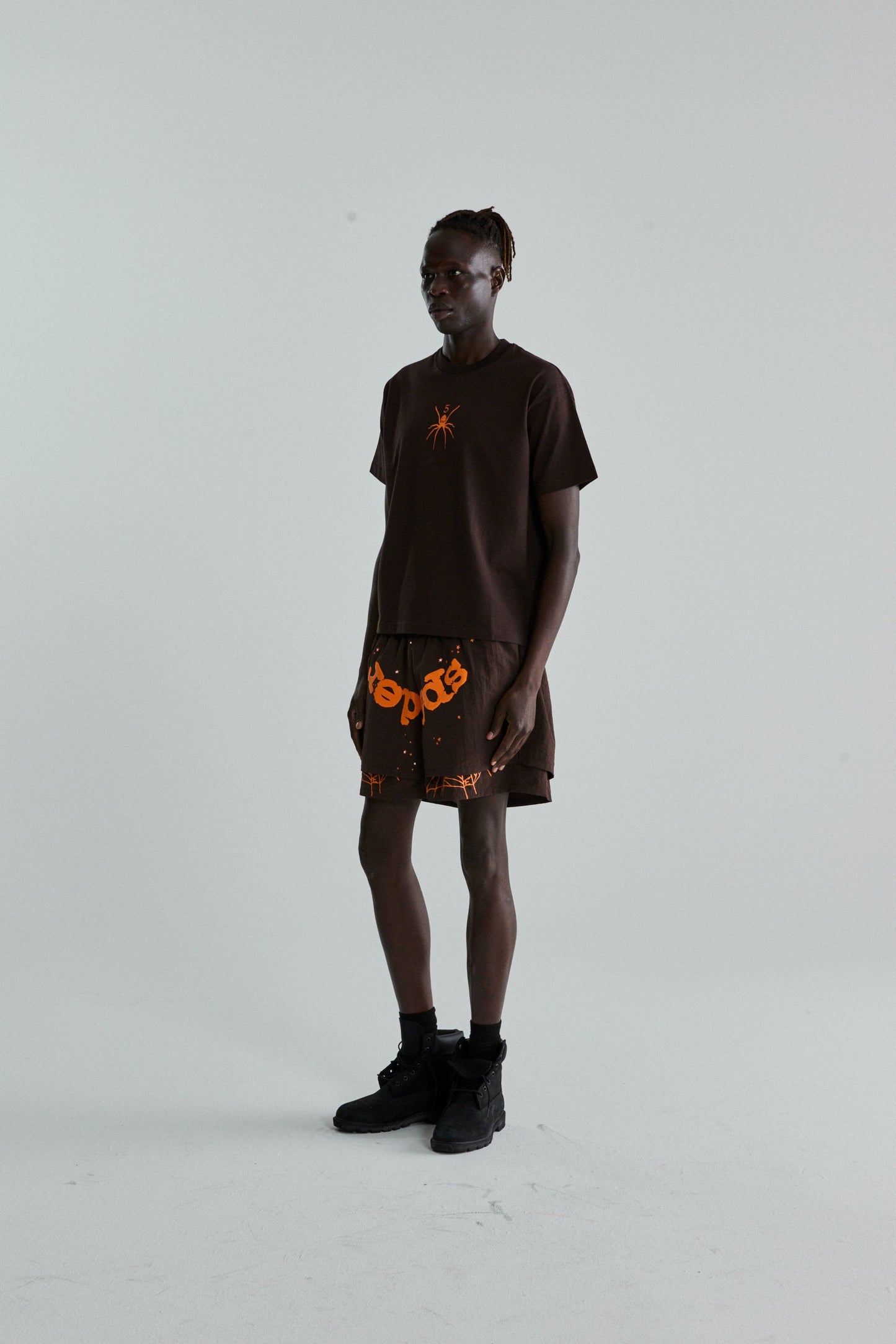 BROWN TM TEE ON MODEL