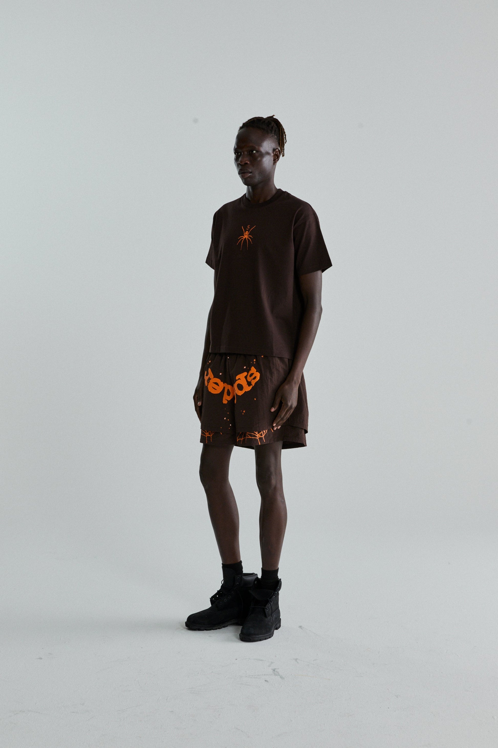BROWN TM TEE ON MODEL
