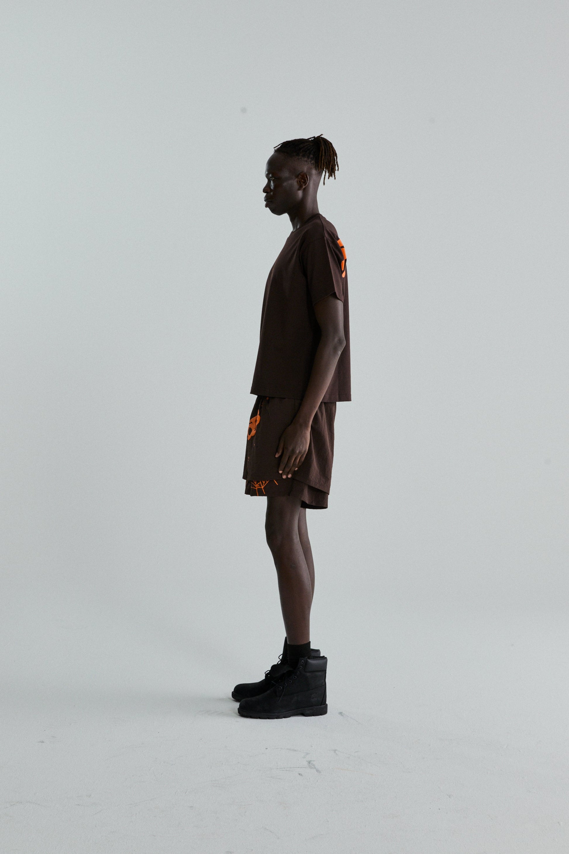 BROWN TM TEE ON MODEL