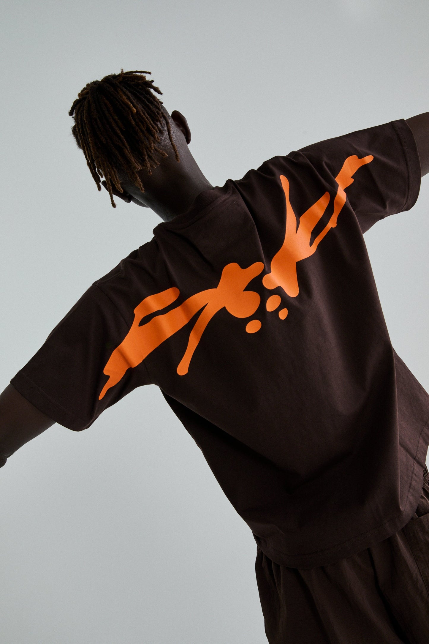 BROWN TM TEE ON MODEL