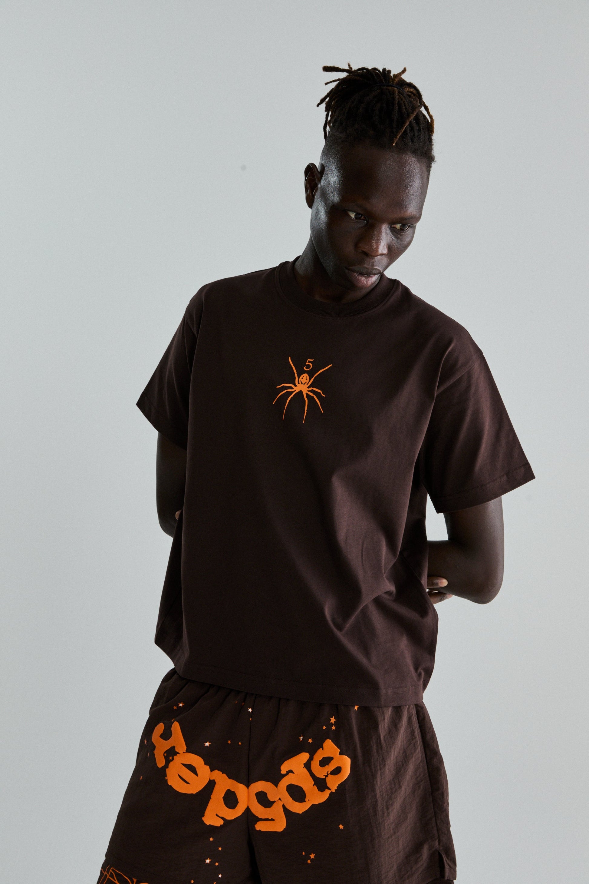 BROWN TM TEE ON MODEL