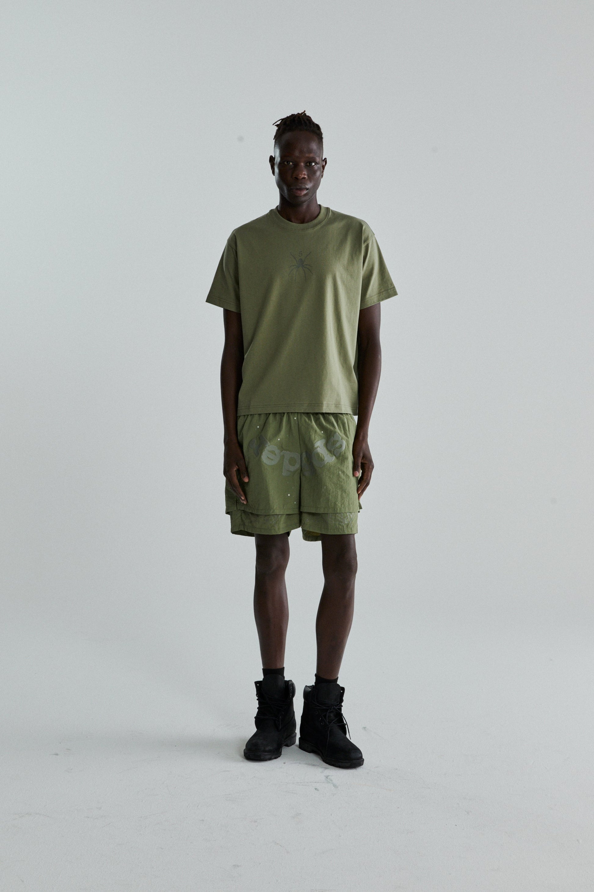 SAGE GREEN TM TEE ON MODEL