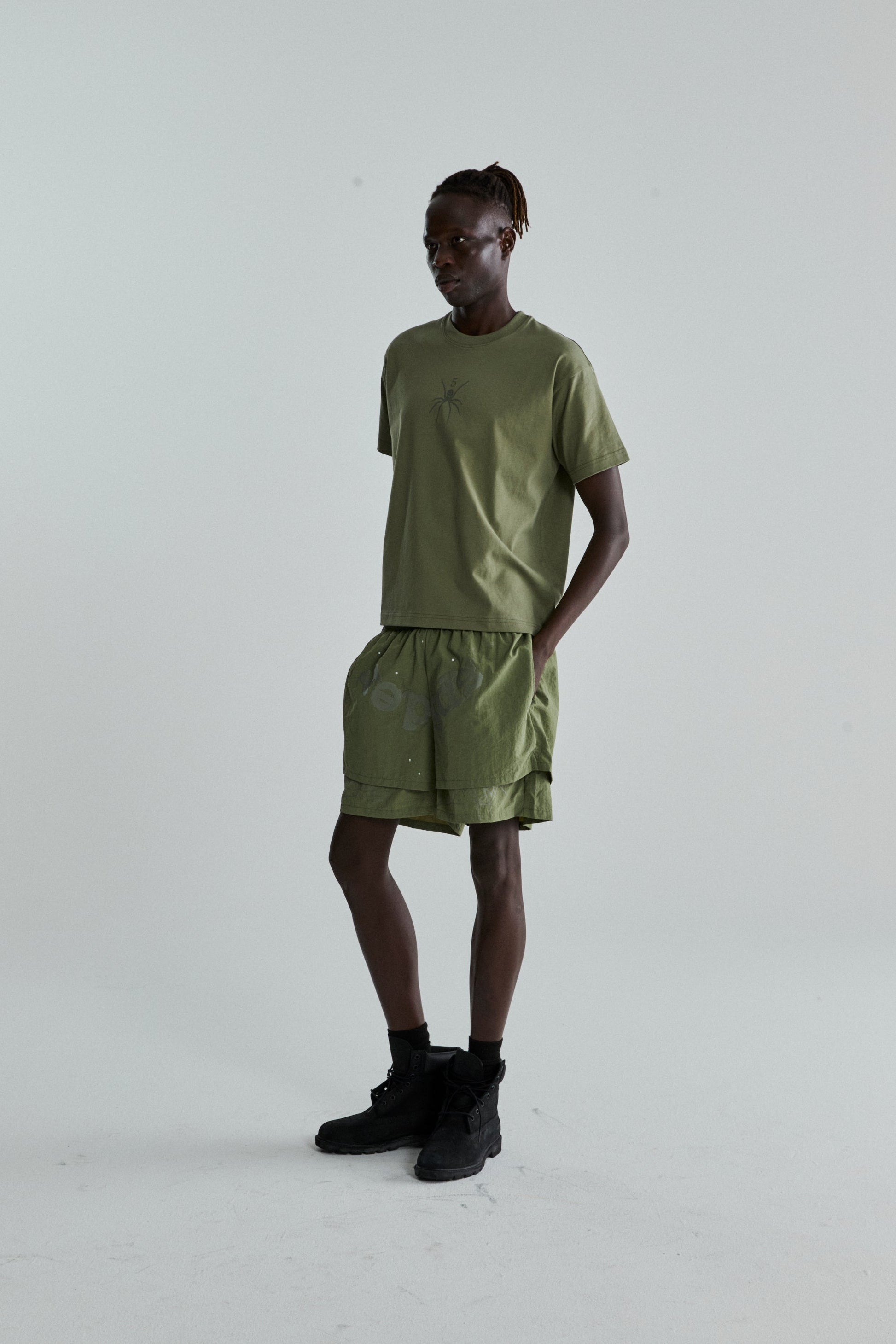 SAGE GREEN TM TEE ON MODEL