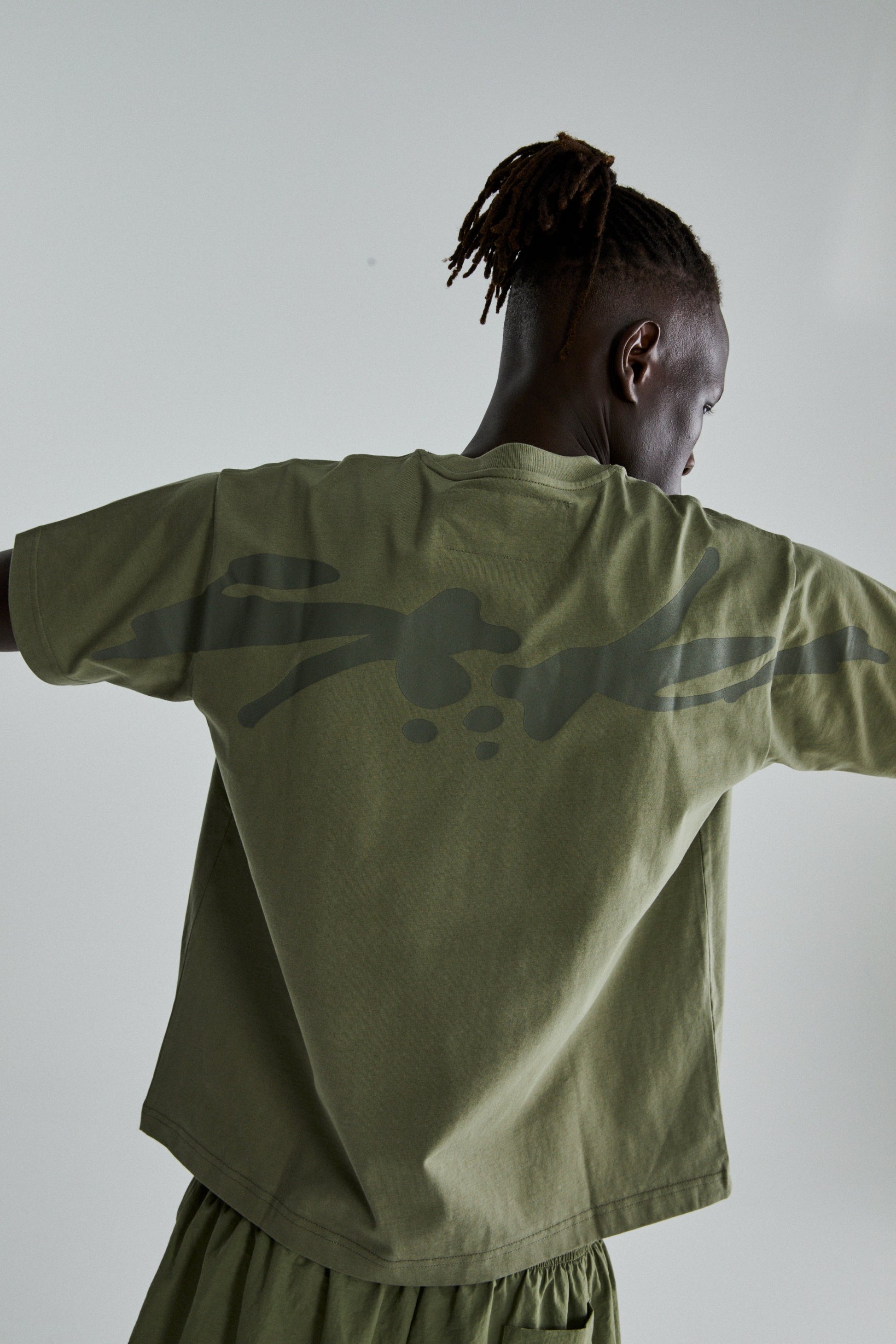 SAGE GREEN TM TEE ON MODEL