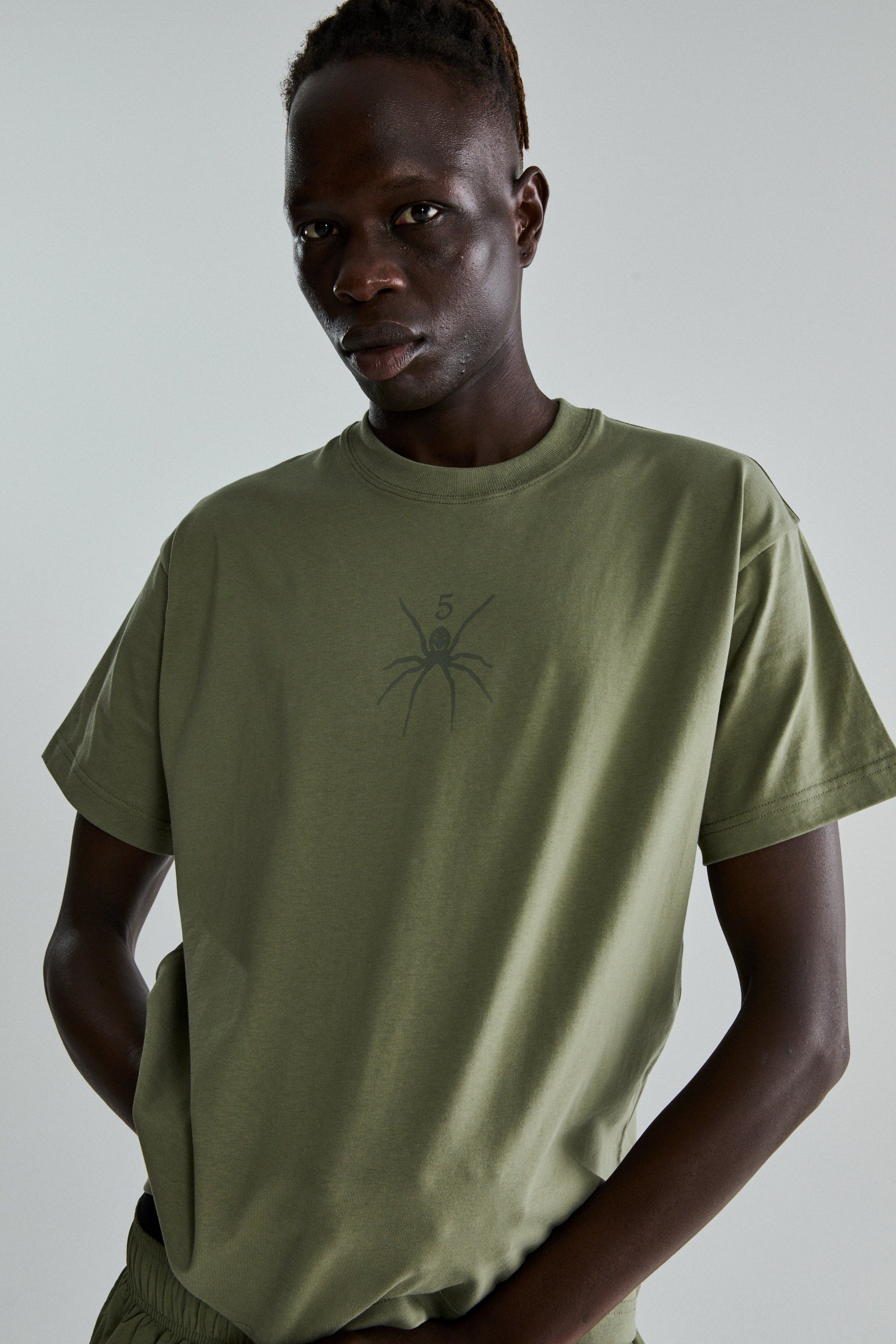 SAGE GREEN TM TEE ON MODEL