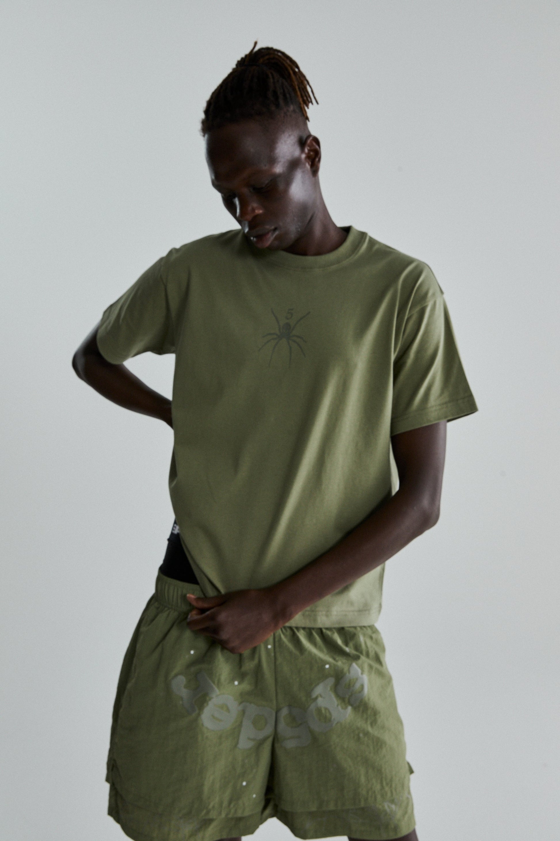 SAGE GREEN TM TEE ON MODEL