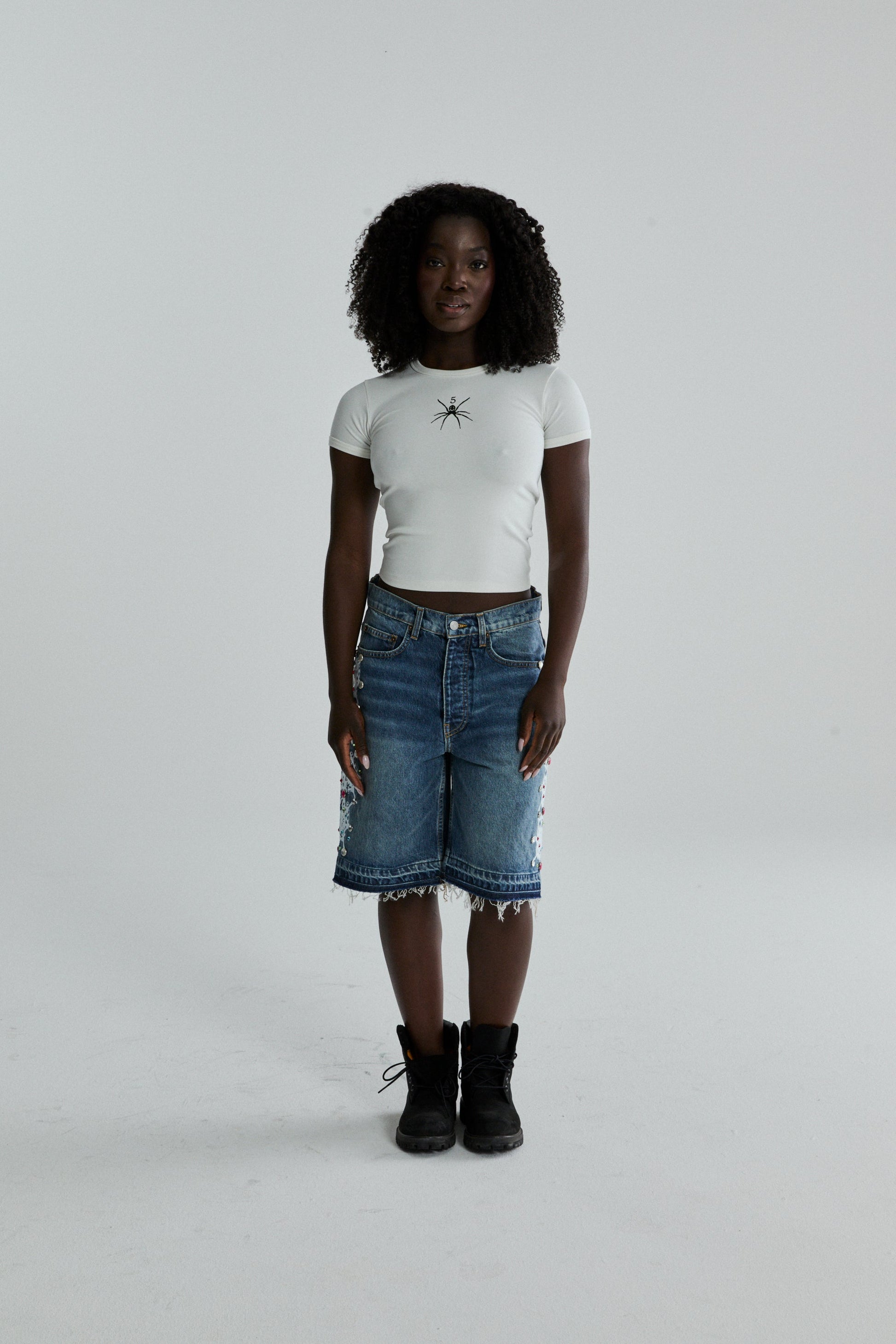 WHITE TM BABY TEE ON MODEL